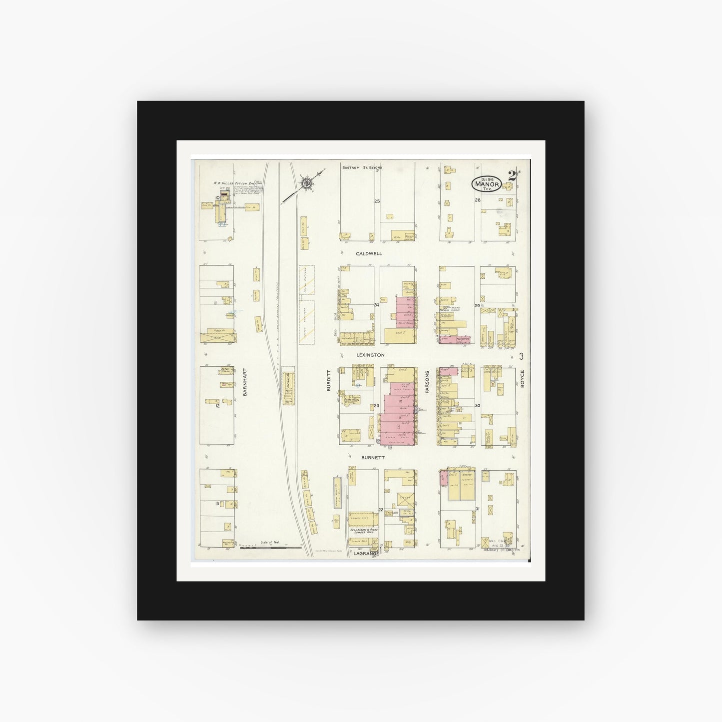 Old map wall art mockup — black gallery frame with white mat — Sanborn Fire Insurance Map from Manor, Travis County, Texas (1916), Sheet #0002