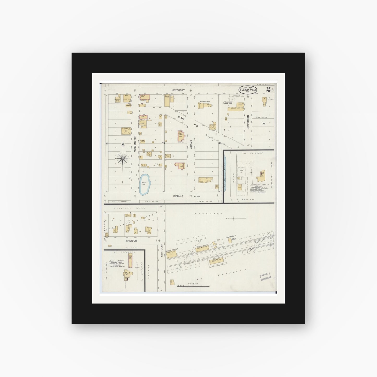 Old map wall art mockup — black gallery frame with white mat — Sanborn Fire Insurance Map from Saint Croix Falls, Polk County, Wisconsin (1899), Sheet #0002