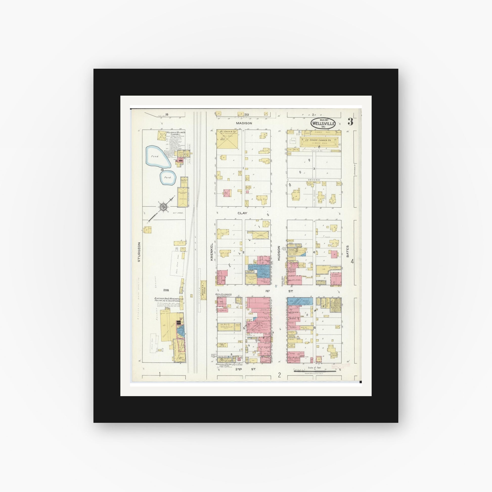 Old map wall art mockup — black gallery frame with white mat — Sanborn Fire Insurance Map from Wellsville, Montgomery County, Missouri (1917), Sheet #0003