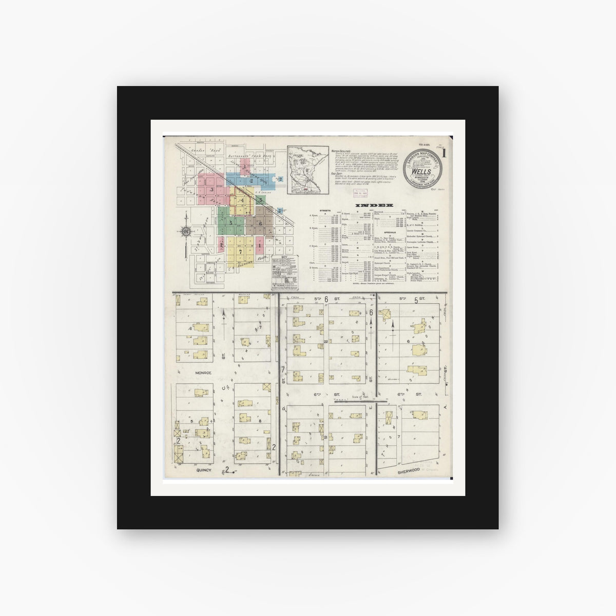 Old map wall art mockup — black gallery frame with white mat — Sanborn Fire Insurance Map from Wells, Faribault County, Minnesota (1914), Sheet #0001