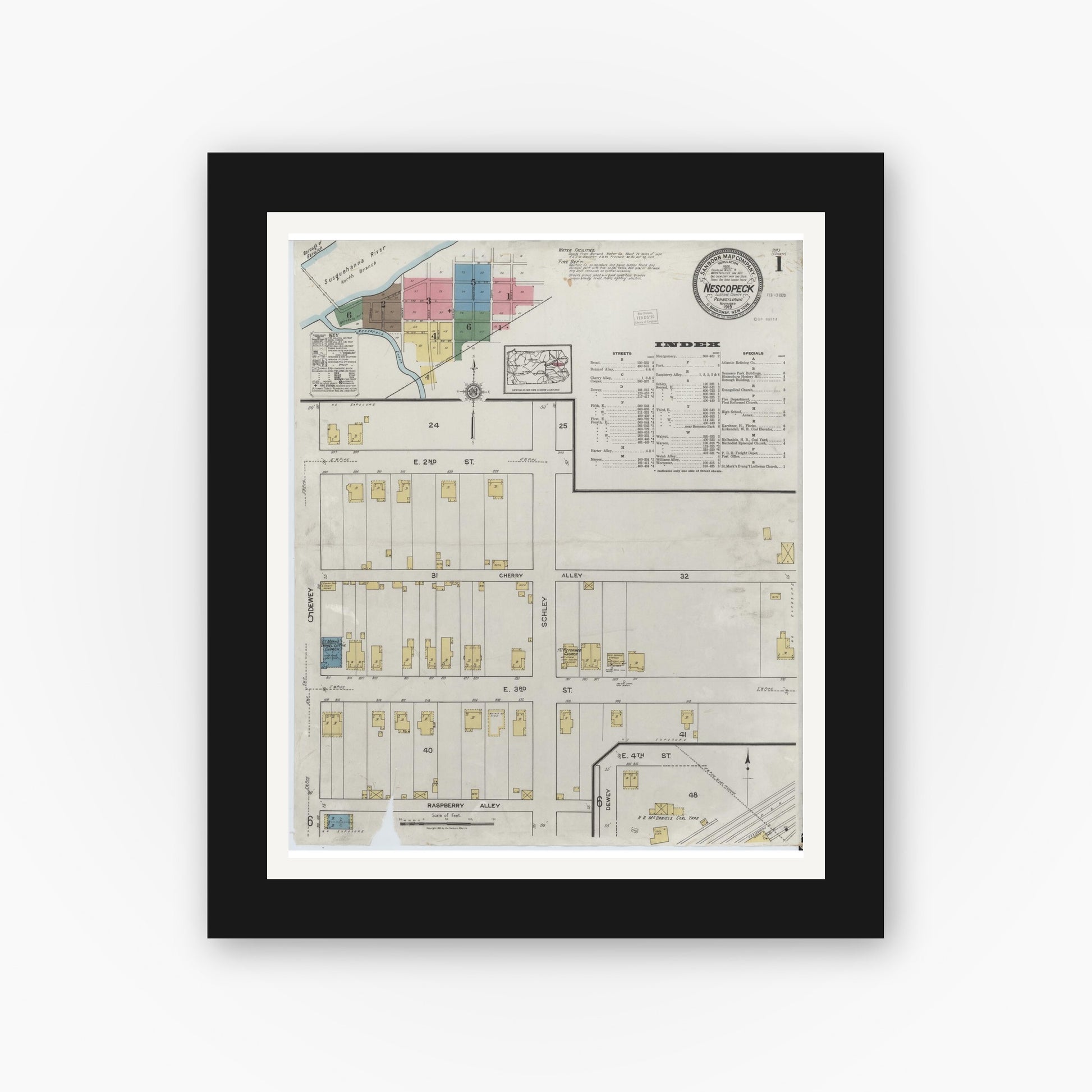 Old map wall art mockup — black gallery frame with white mat — Sanborn Fire Insurance Map from Nescopeck, Luzerne County, Pennsylvania (1919), Sheet #0001
