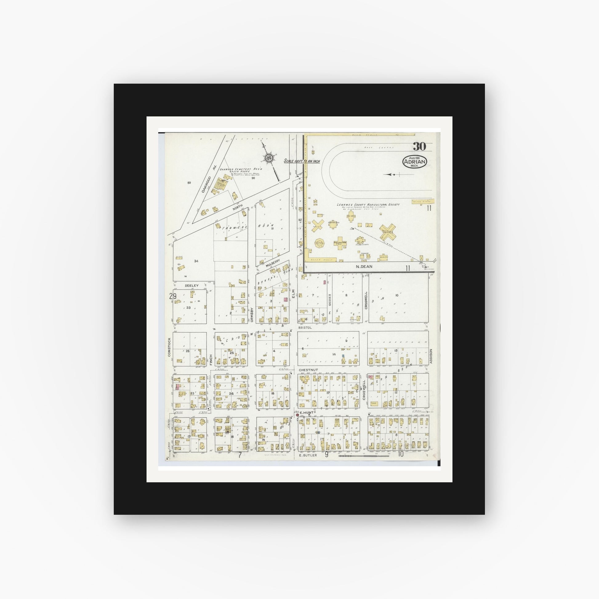 Old map wall art mockup — black gallery frame with white mat — Sanborn Fire Insurance Map from Adrian, Lenawee County, Michigan (1916), Sheet #0030