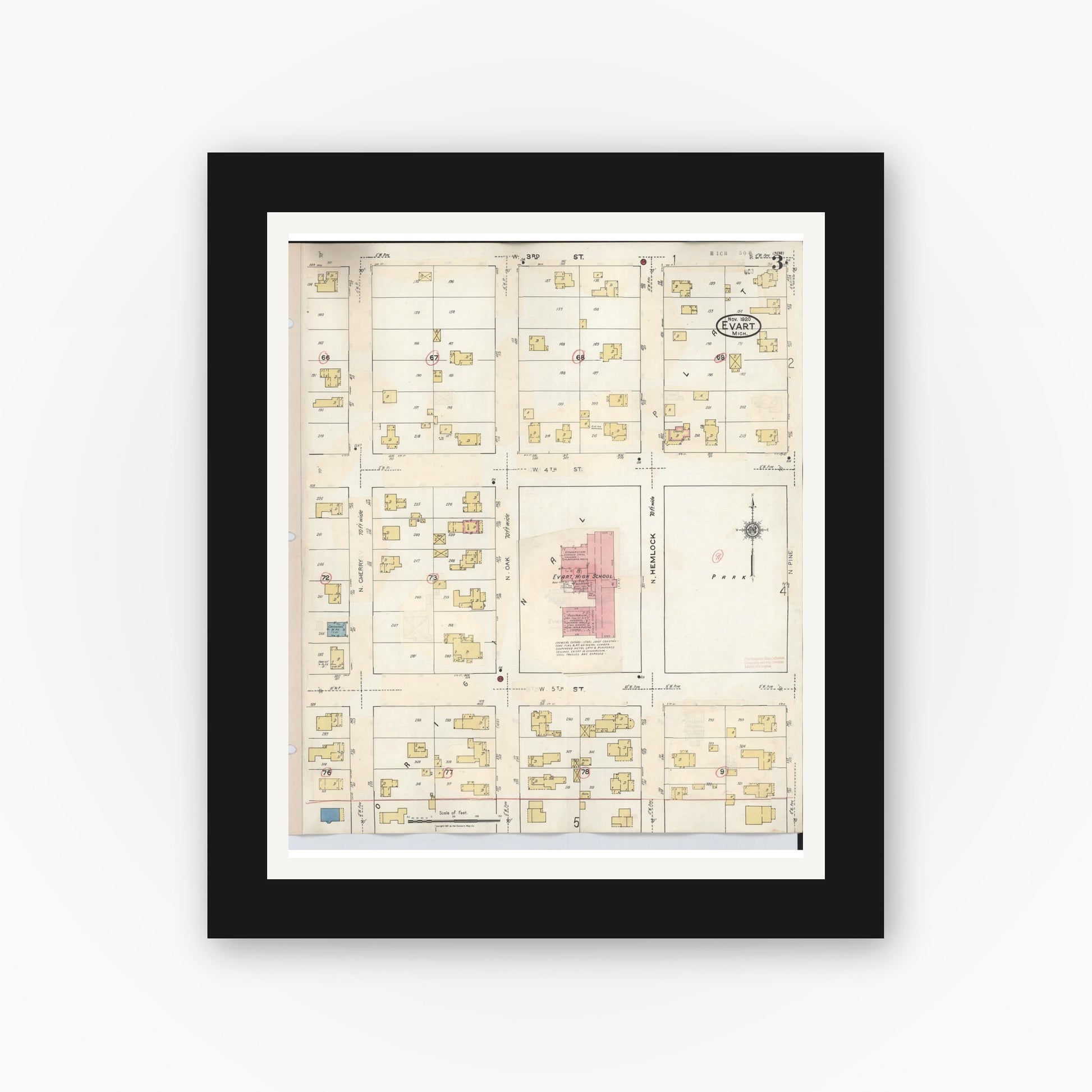Old map wall art mockup — black gallery frame with white mat — Sanborn Fire Insurance Map from Evart, Osceola County, Michigan (1942), Sheet #0003
