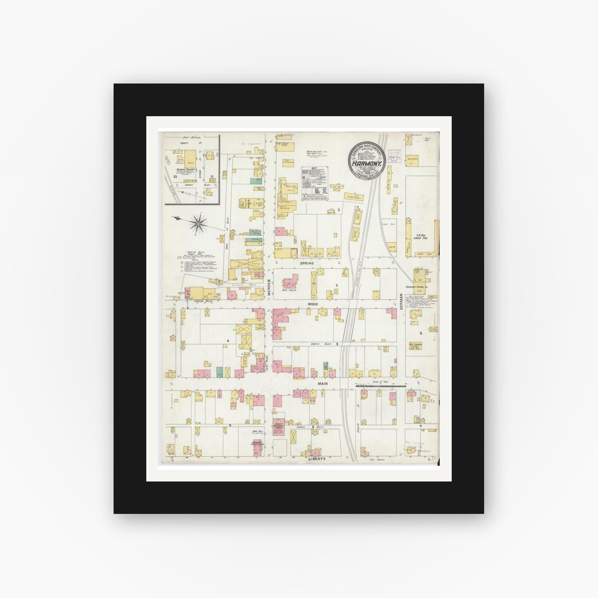 Old map wall art mockup — black gallery frame with white mat — Sanborn Fire Insurance Map from Harmony, Butler County, Pennsylvania (1906), Sheet #0001