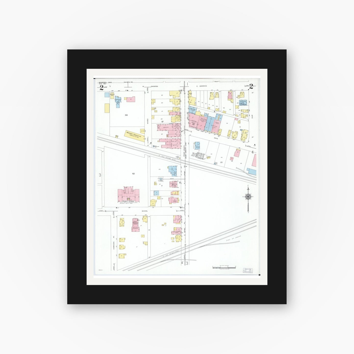 Old map wall art mockup — black gallery frame with white mat — Sanborn Fire Insurance Map from Bradford, Darke and Miami Counties, Ohio (1951), Sheet #0002