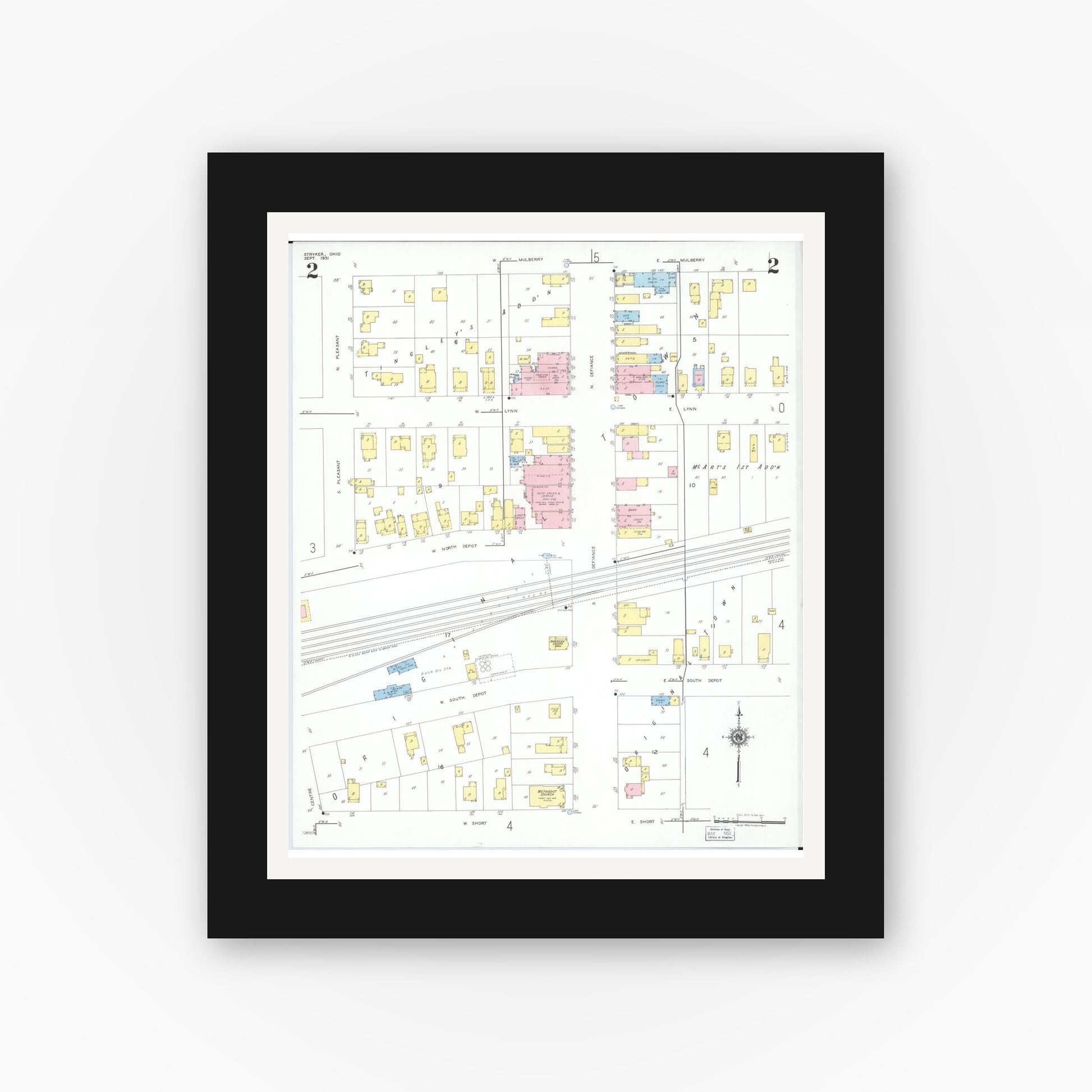 Old map wall art mockup — black gallery frame with white mat — Sanborn Fire Insurance Map from Stryker, Williams County, Ohio (1951), Sheet #0002