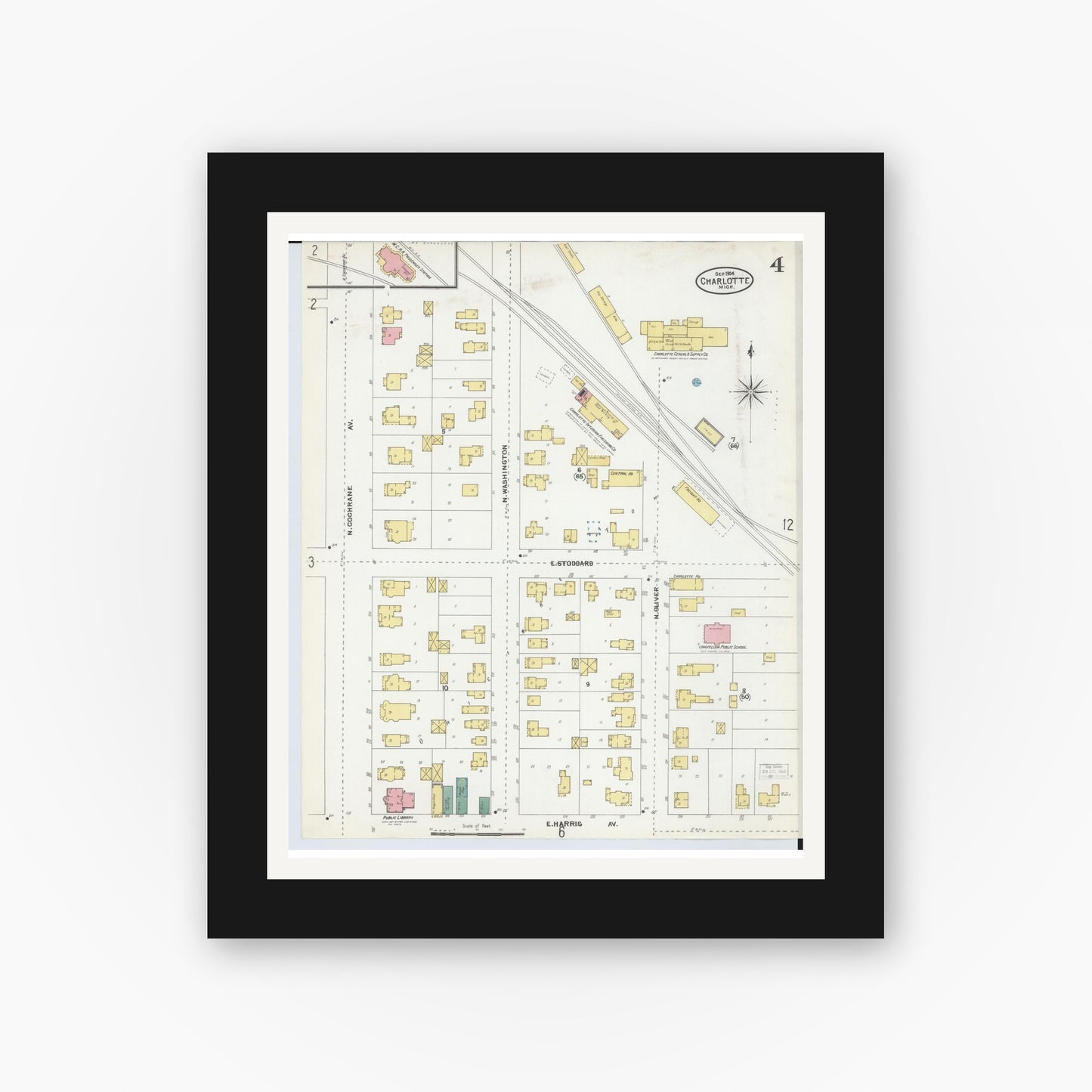 Old map wall art mockup — black gallery frame with white mat — Sanborn Fire Insurance Map from Charlotte, Eaton County, Michigan (1904), Sheet #0004