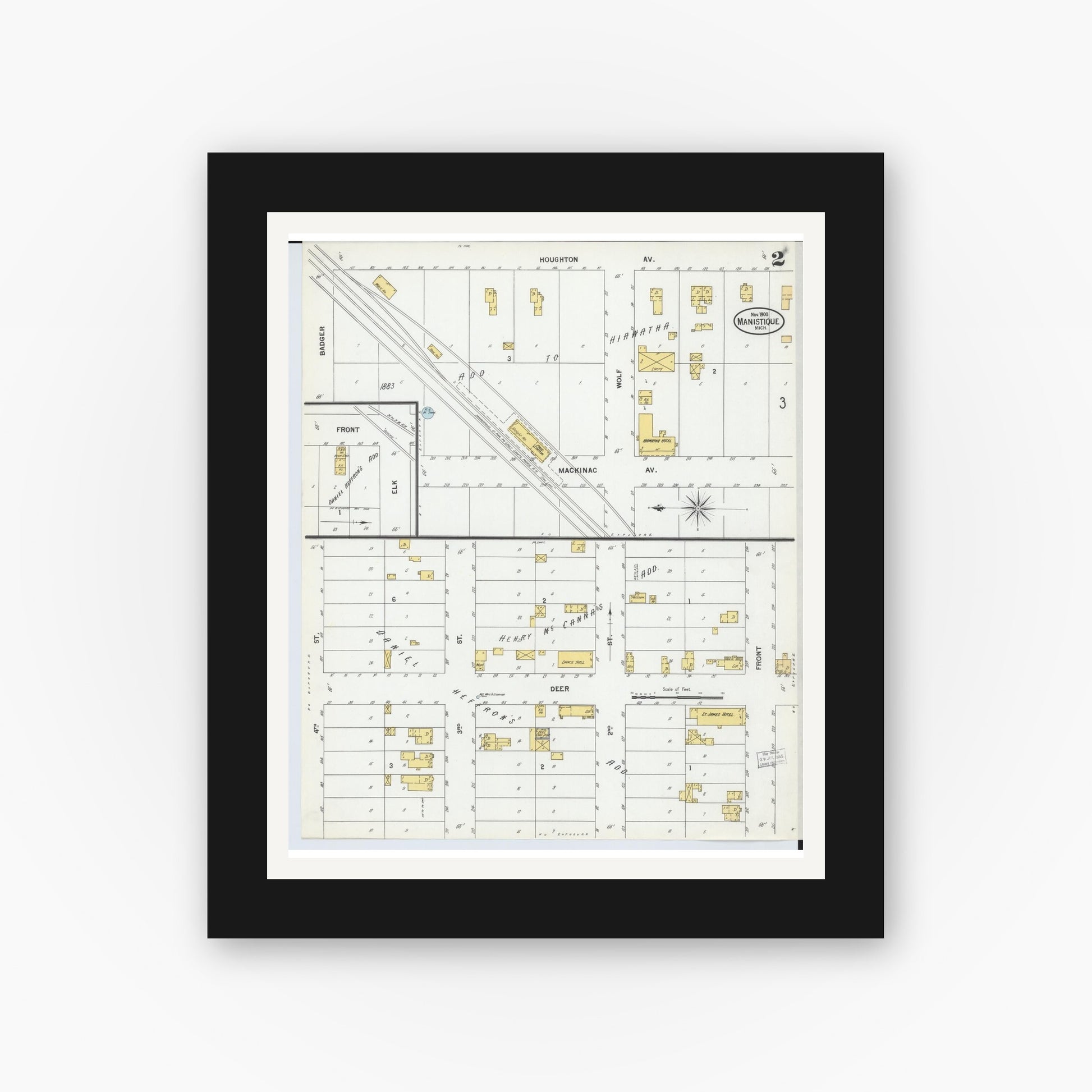 Old map wall art mockup — black gallery frame with white mat — Sanborn Fire Insurance Map from Manistique, Schoolcraft County, Michigan (1900), Sheet #0002