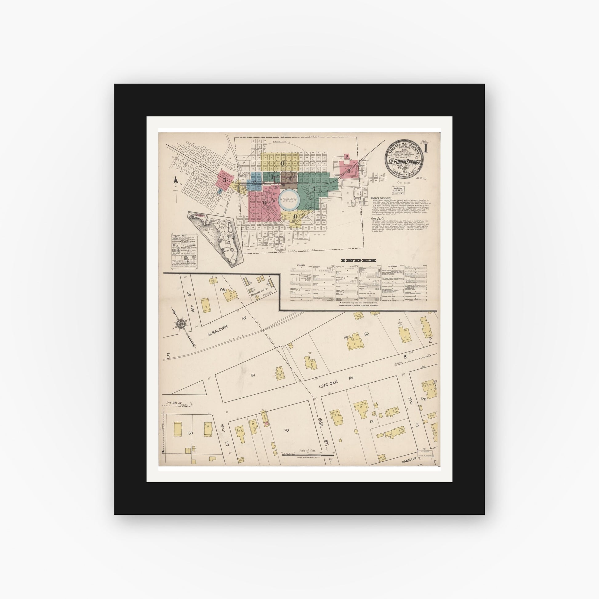 Old map wall art mockup — black gallery frame with white mat — Sanborn Fire Insurance Map from De Funiak Springs, Walton County, Florida (1922), Sheet #0001