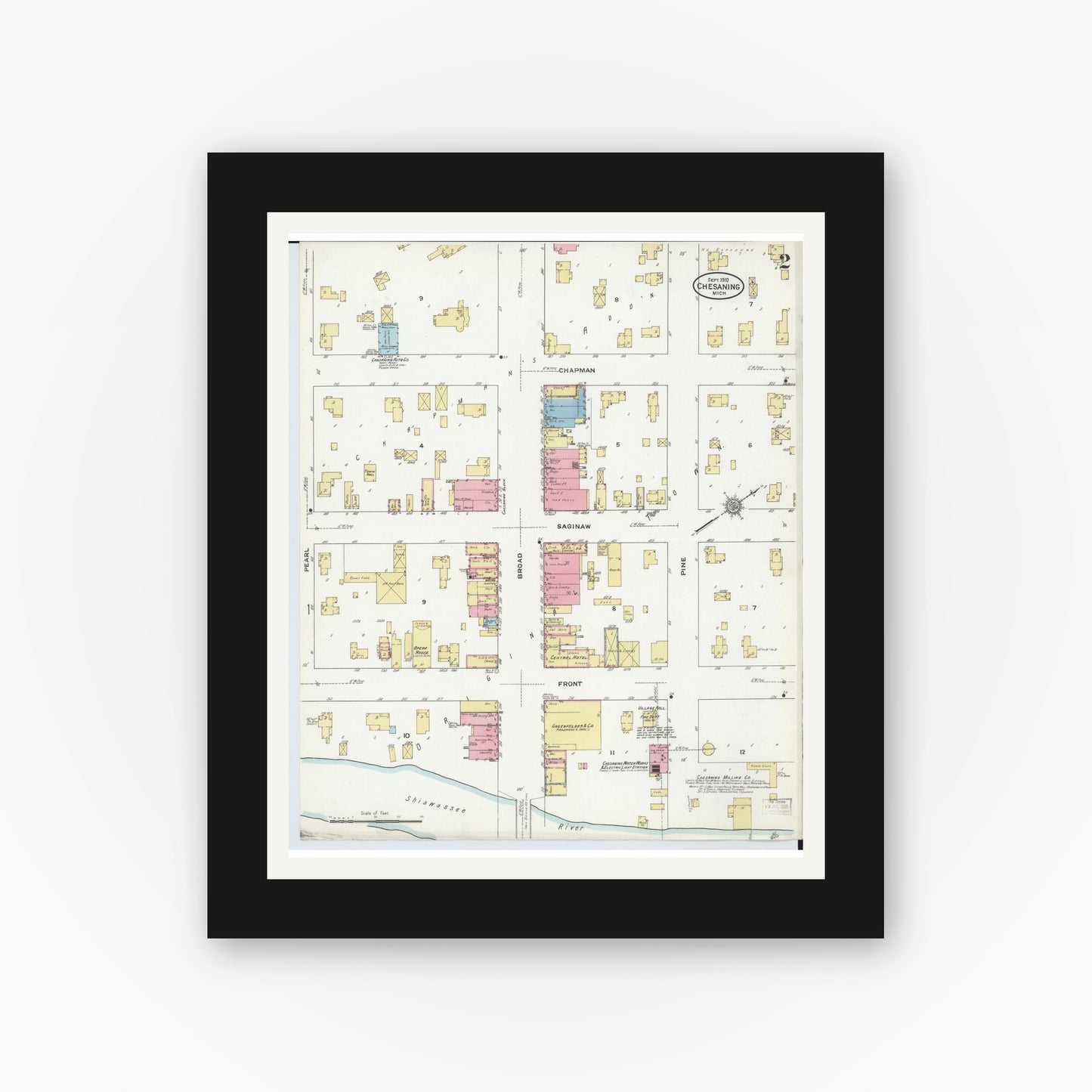 Old map wall art mockup — black gallery frame with white mat — Sanborn Fire Insurance Map from Chesaning, Saginaw County, Michigan (1910), Sheet #0002