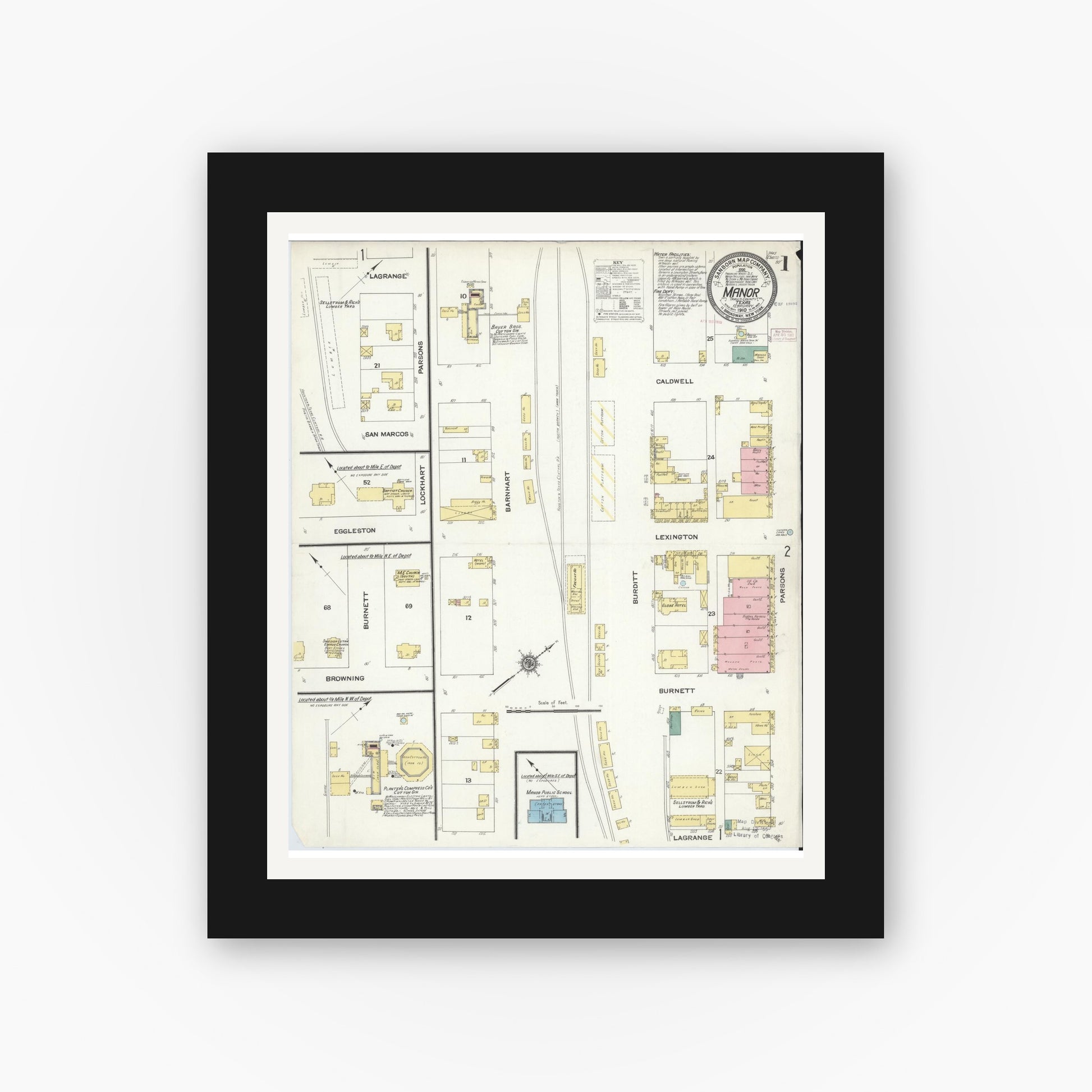 Old map wall art mockup — black gallery frame with white mat — Sanborn Fire Insurance Map from Manor, Travis County, Texas (1910), Sheet #0001