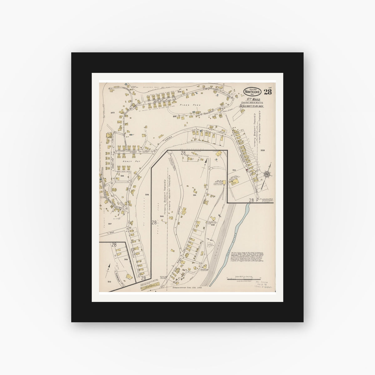 Old map wall art mockup — black gallery frame with white mat — Sanborn Fire Insurance Map from Nanticoke, Luzerne County, Pennsylvania (1920), Sheet #0028