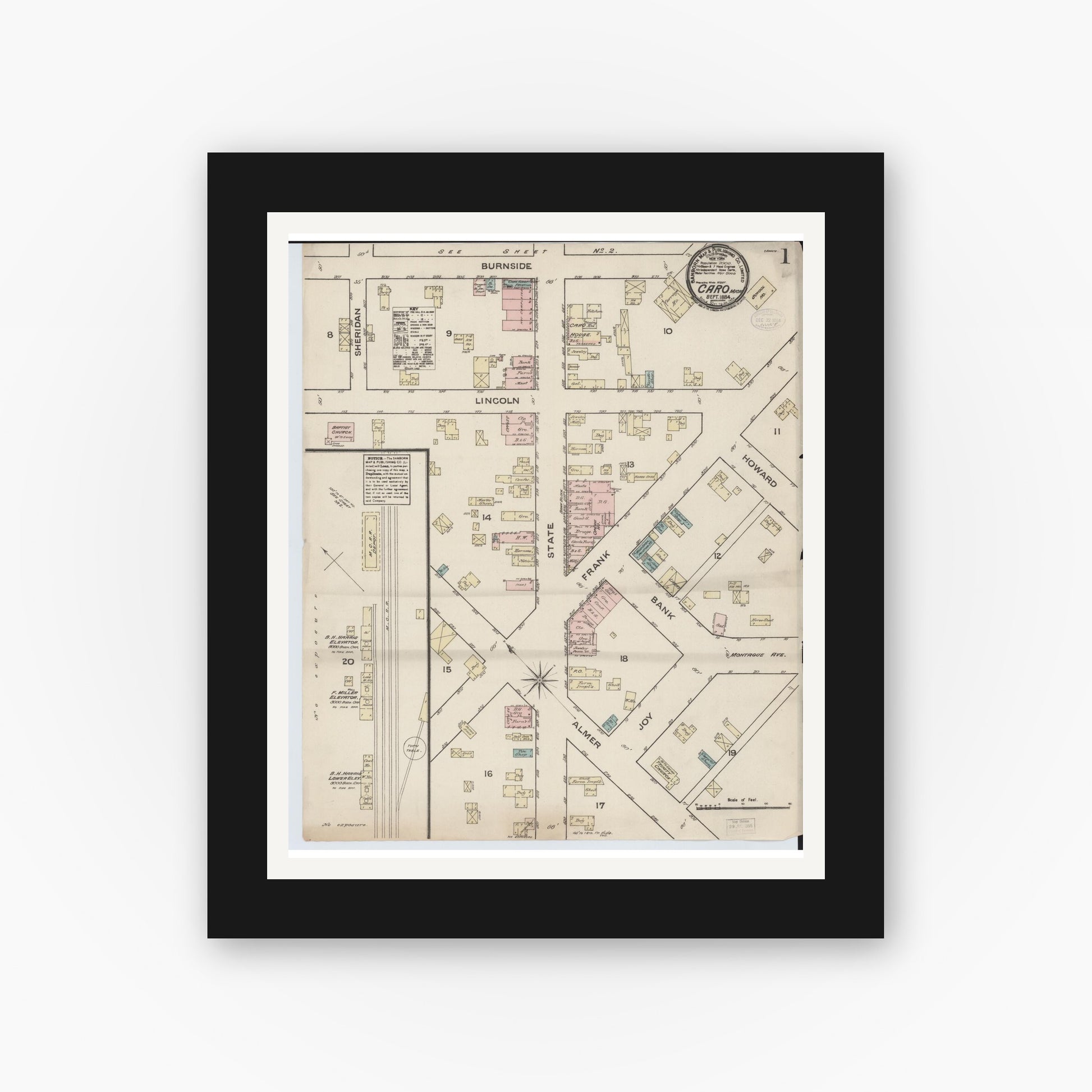 Old map wall art mockup — black gallery frame with white mat — Sanborn Fire Insurance Map from Caro, Tuscola County, Michigan (1884), Sheet #0001