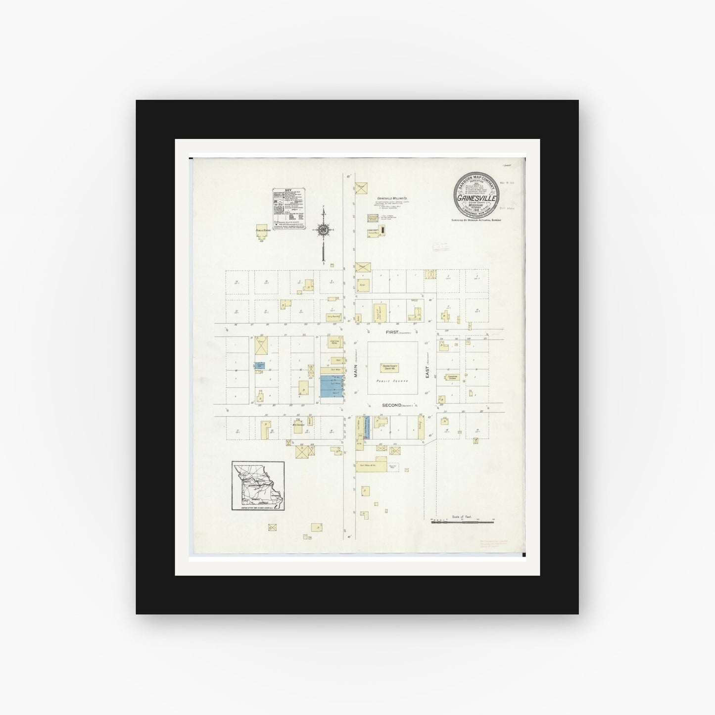 Old map wall art mockup — black gallery frame with white mat — Sanborn Fire Insurance Map from Gainesville, Ozark County, Missouri (1912), Sheet #0001