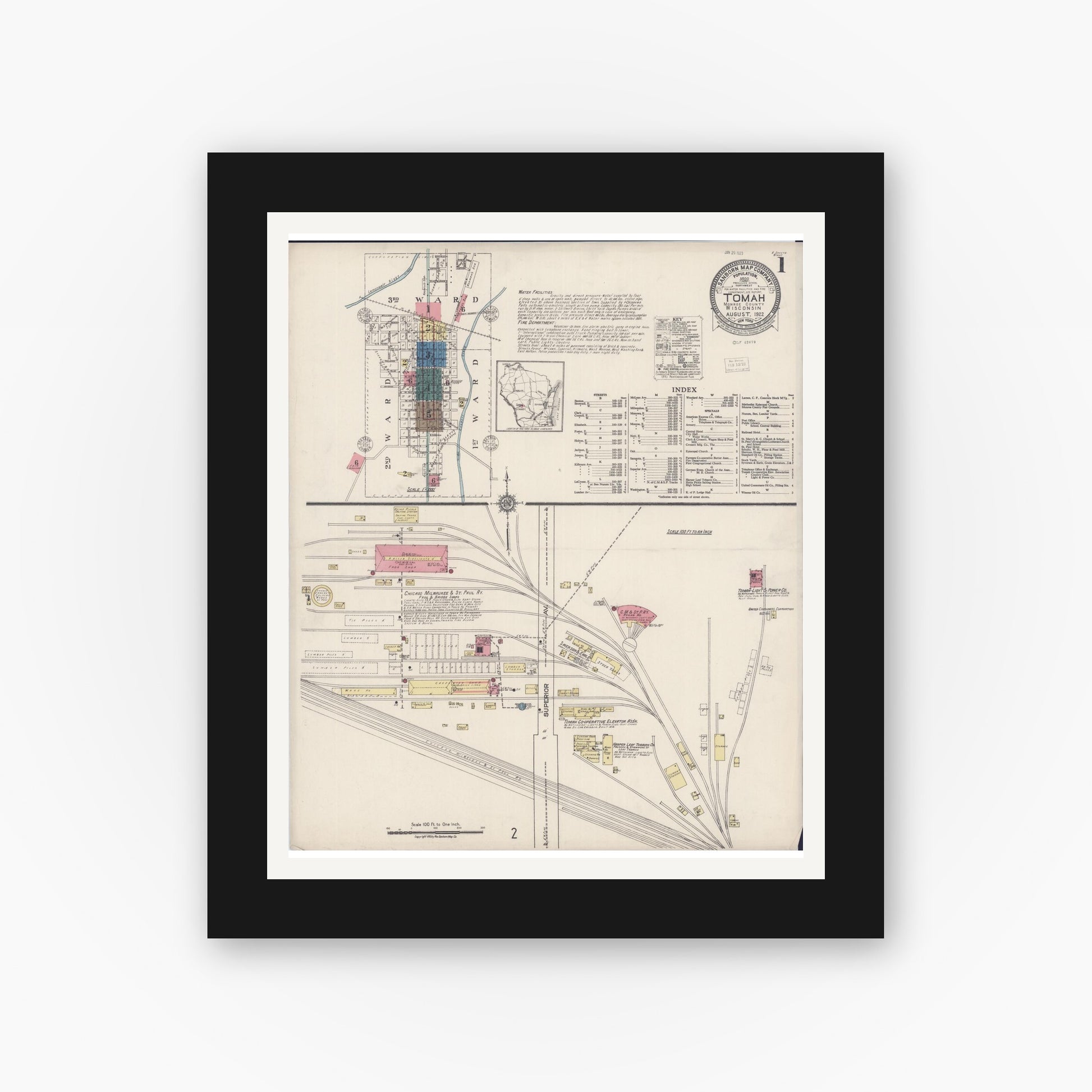 Old map wall art mockup — black gallery frame with white mat — Sanborn Fire Insurance Map from Tomah, Monroe County, Wisconsin (1922), Sheet #0001