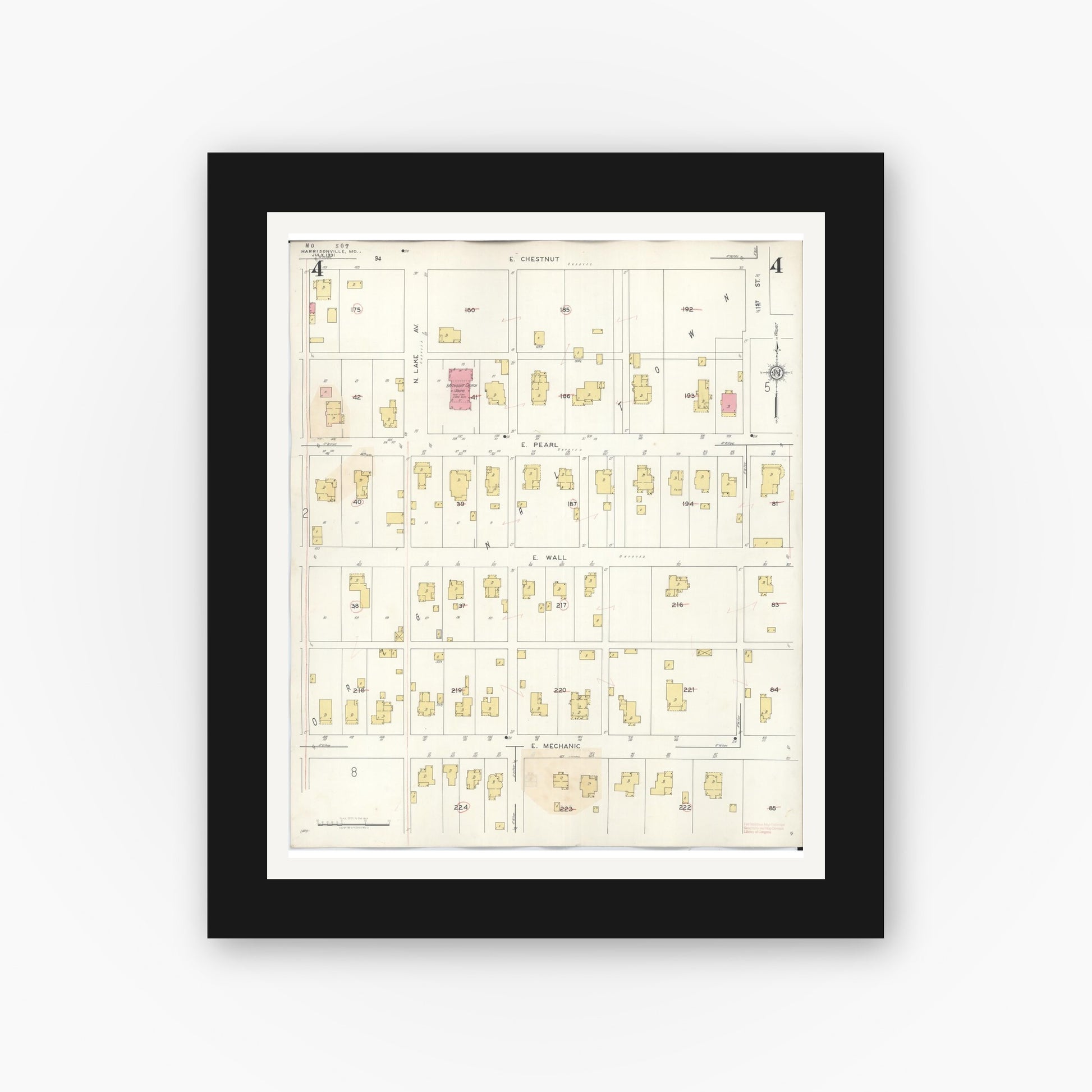 Old map wall art mockup — black gallery frame with white mat — Sanborn Fire Insurance Map from Harrisonville, Cass County, Missouri (1939), Sheet #0004