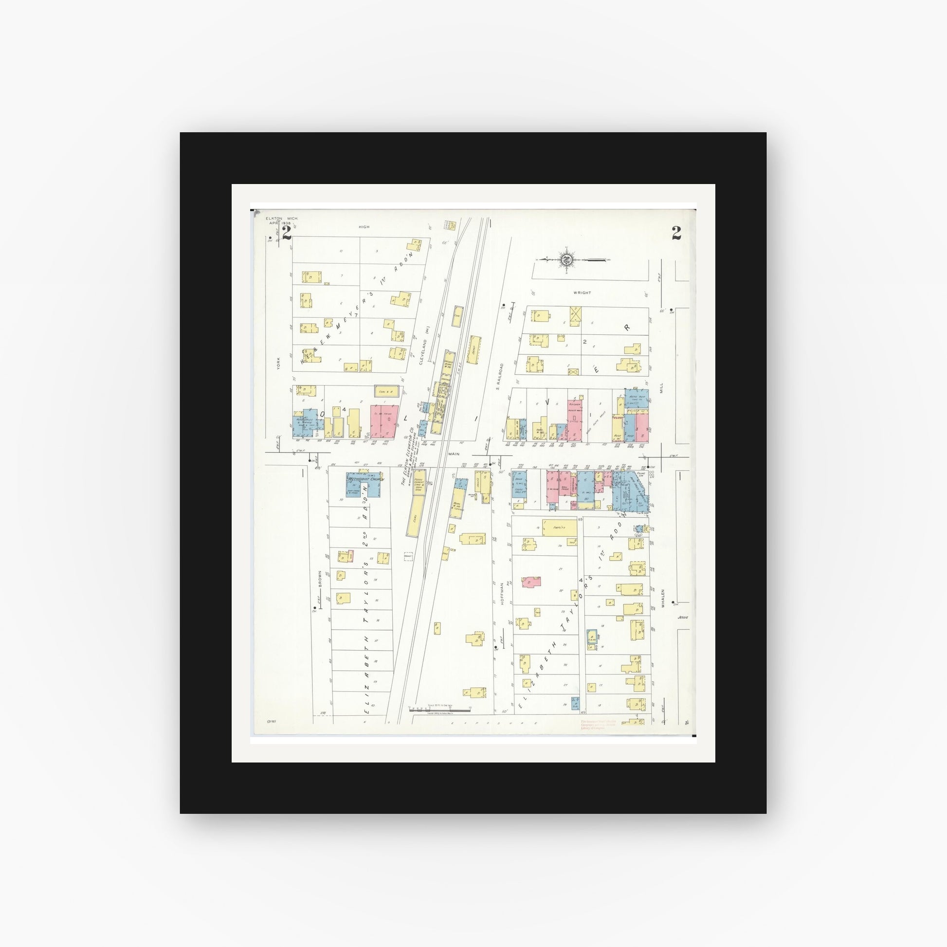 Old map wall art mockup — black gallery frame with white mat — Sanborn Fire Insurance Map from Elkton, Huron County, Michigan (1938), Sheet #0002