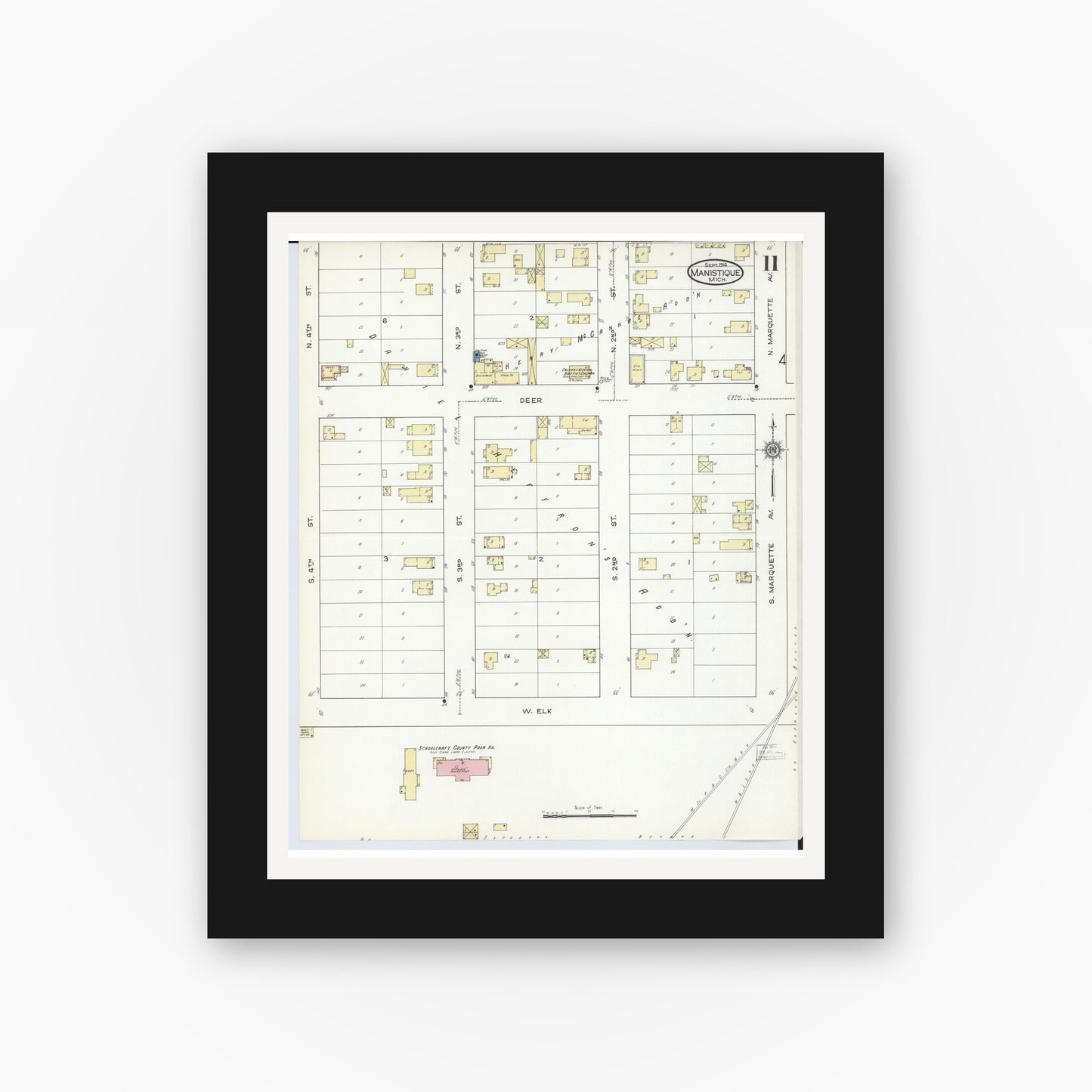 Old map wall art mockup — black gallery frame with white mat — Sanborn Fire Insurance Map from Manistique, Schoolcraft County, Michigan (1914), Sheet #0011
