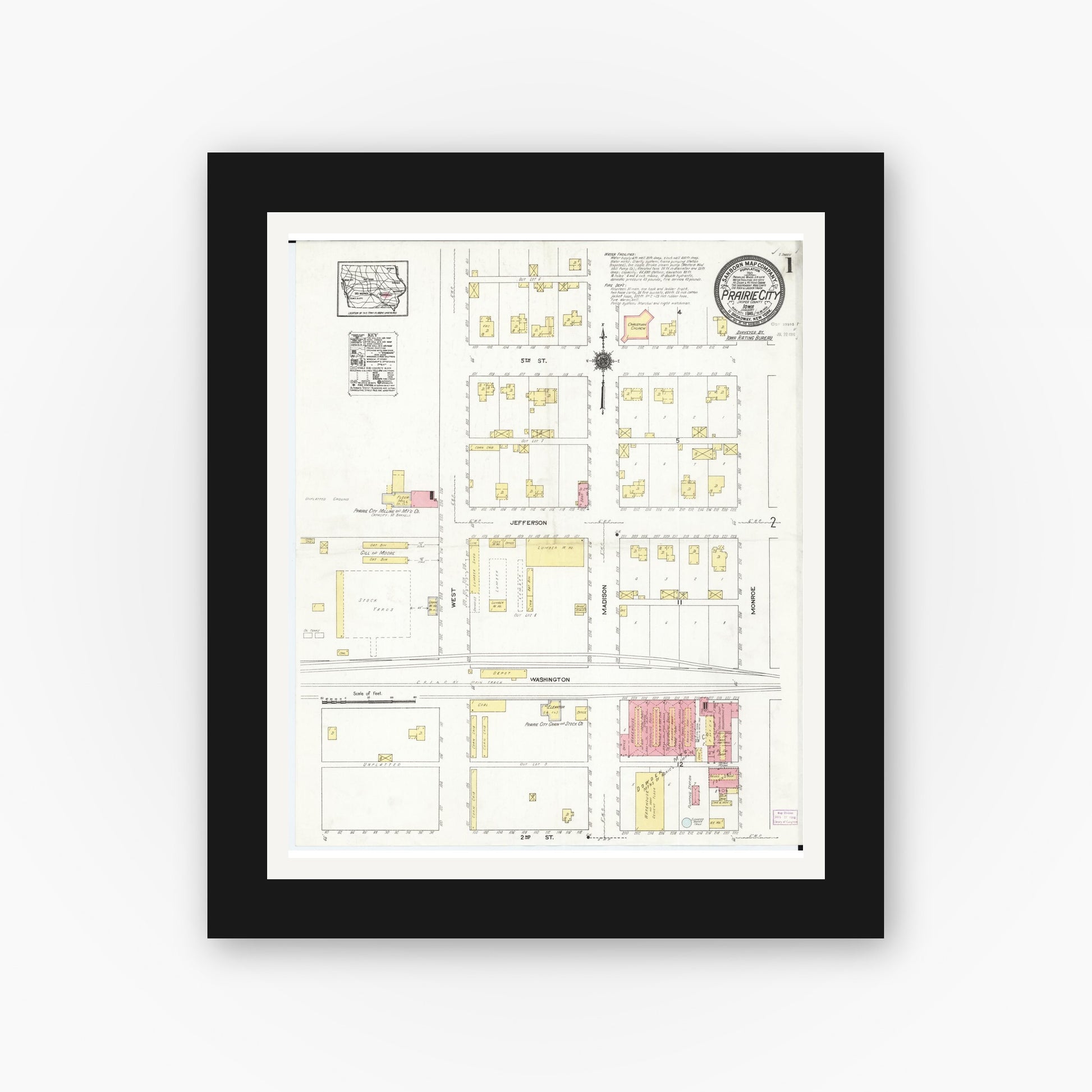 Old map wall art mockup — black gallery frame with white mat — Sanborn Fire Insurance Map from Prairie City, Jasper County, Iowa (1916), Sheet #0001