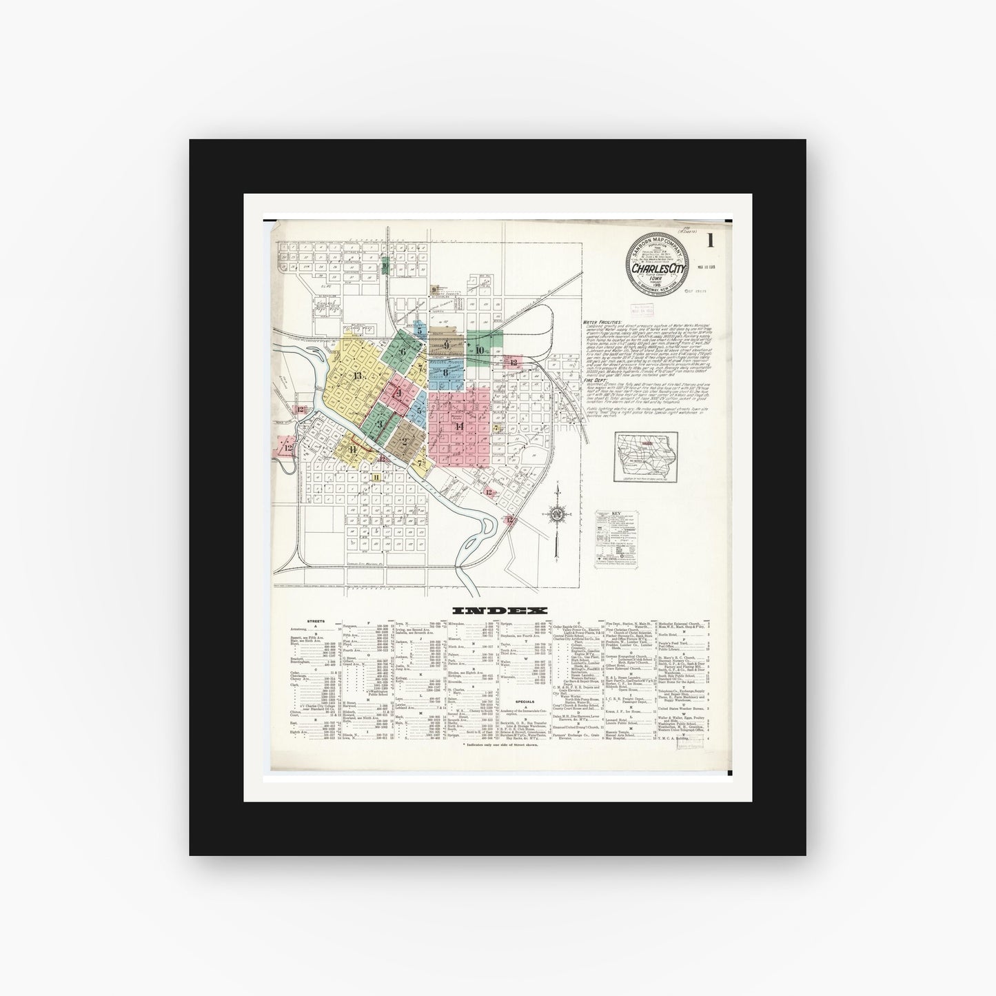 Old map wall art mockup — black gallery frame with white mat — Sanborn Fire Insurance Map from Charles City, Floyd County, Iowa (1915) â€” Complete Set