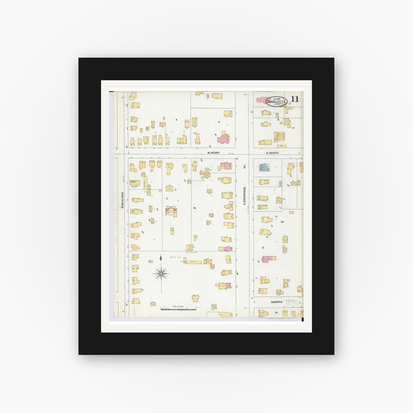 Old map wall art mockup — black gallery frame with white mat — Sanborn Fire Insurance Map from Charlotte, Eaton County, Michigan (1904), Sheet #0011