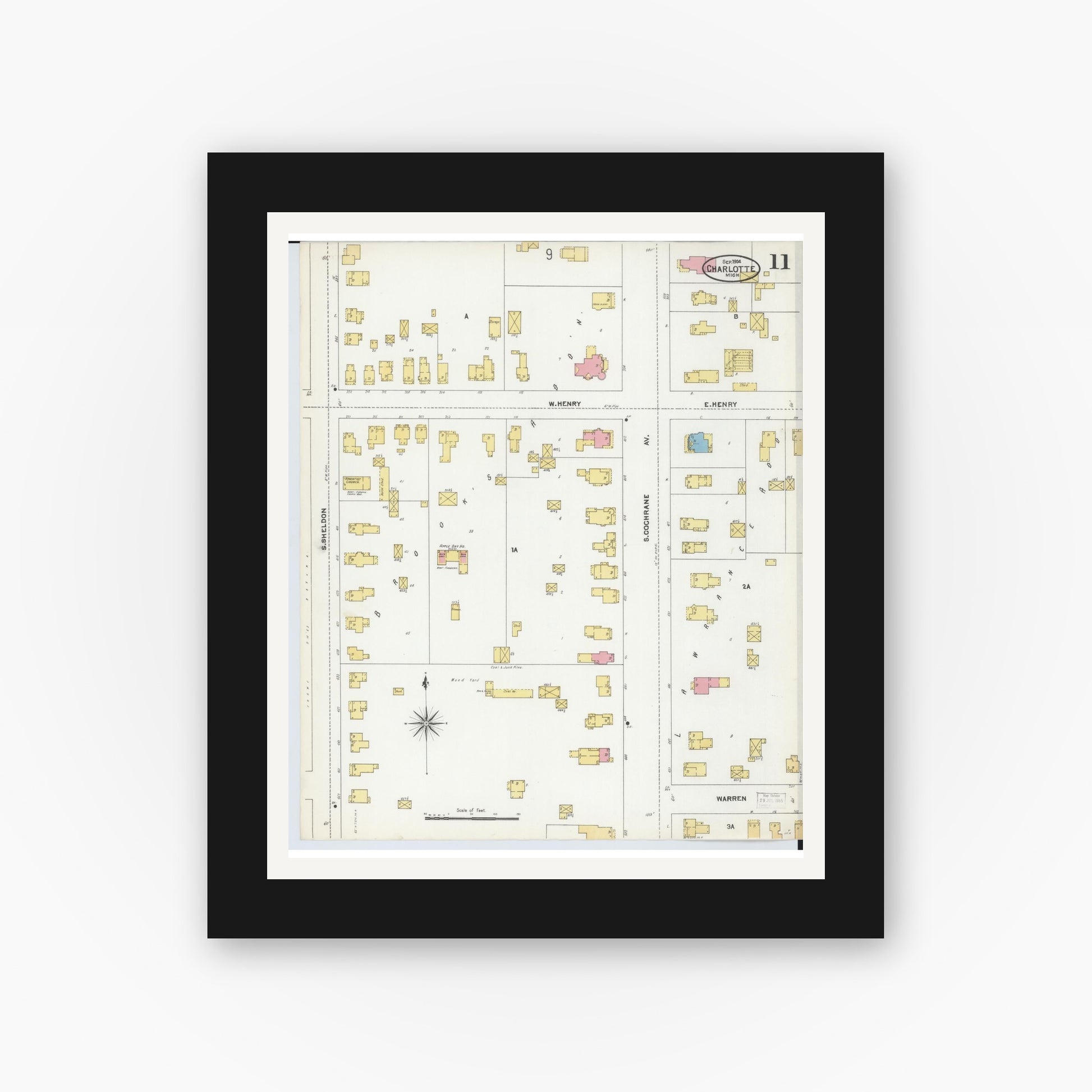 Old map wall art mockup — black gallery frame with white mat — Sanborn Fire Insurance Map from Charlotte, Eaton County, Michigan (1904), Sheet #0011