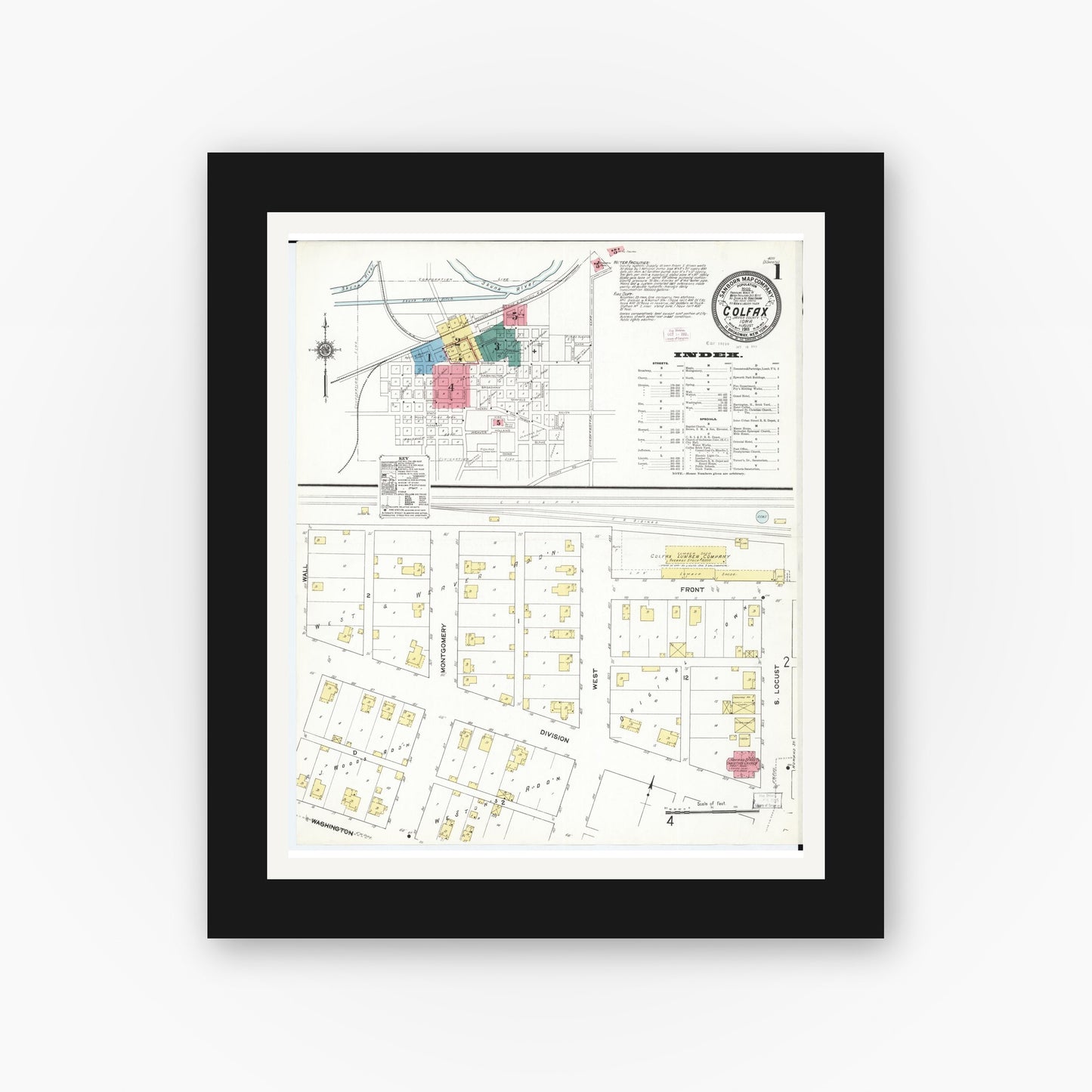 Old map wall art mockup — black gallery frame with white mat — Sanborn Fire Insurance Map from Colfax, Jasper County, Iowa (1911) â€” Complete Set
