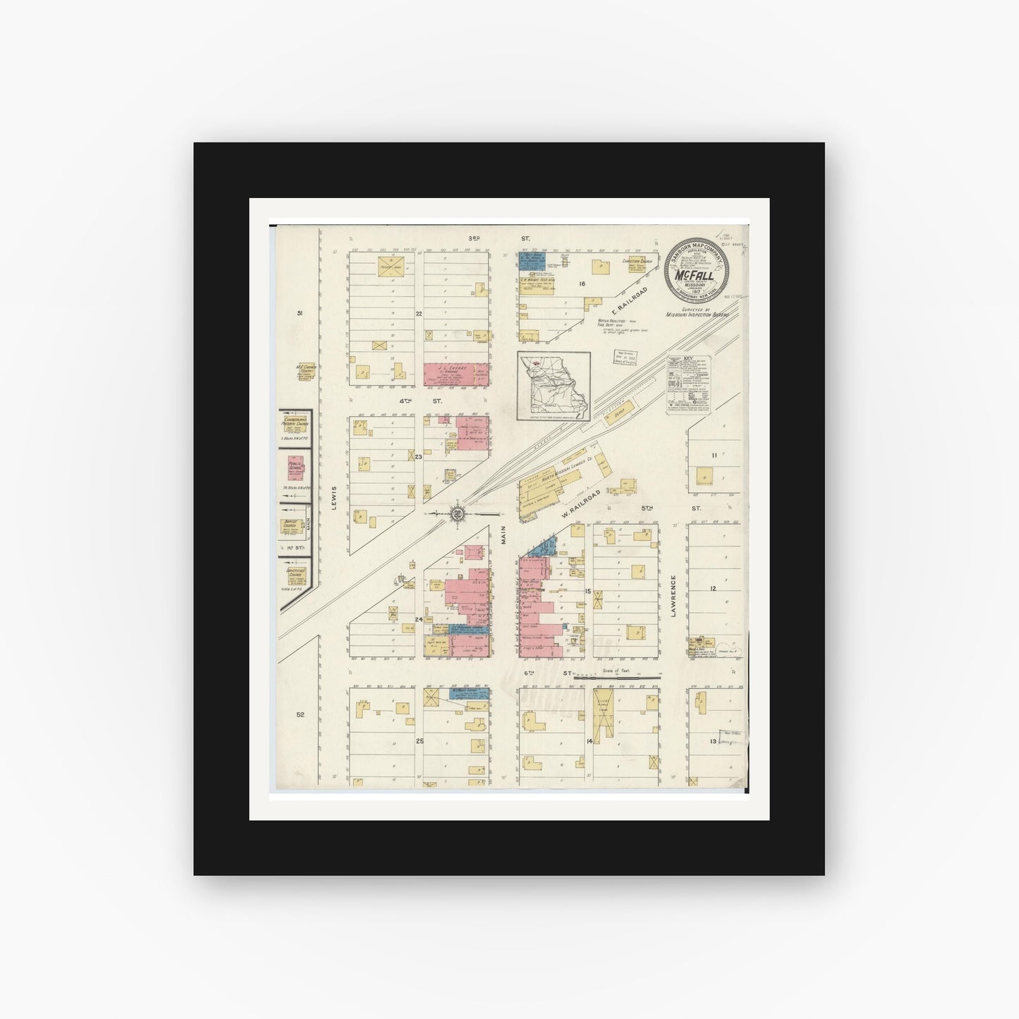 Old map wall art mockup — black gallery frame with white mat — Sanborn Fire Insurance Map from Mcfall, Gentry County, Missouri (1917), Sheet #0001