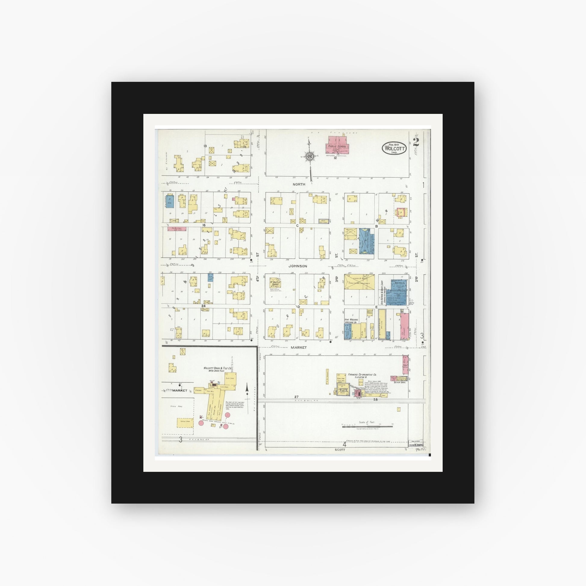 Old map wall art mockup — black gallery frame with white mat — Sanborn Fire Insurance Map from Wolcott, White County, Indiana (1919), Sheet #0002