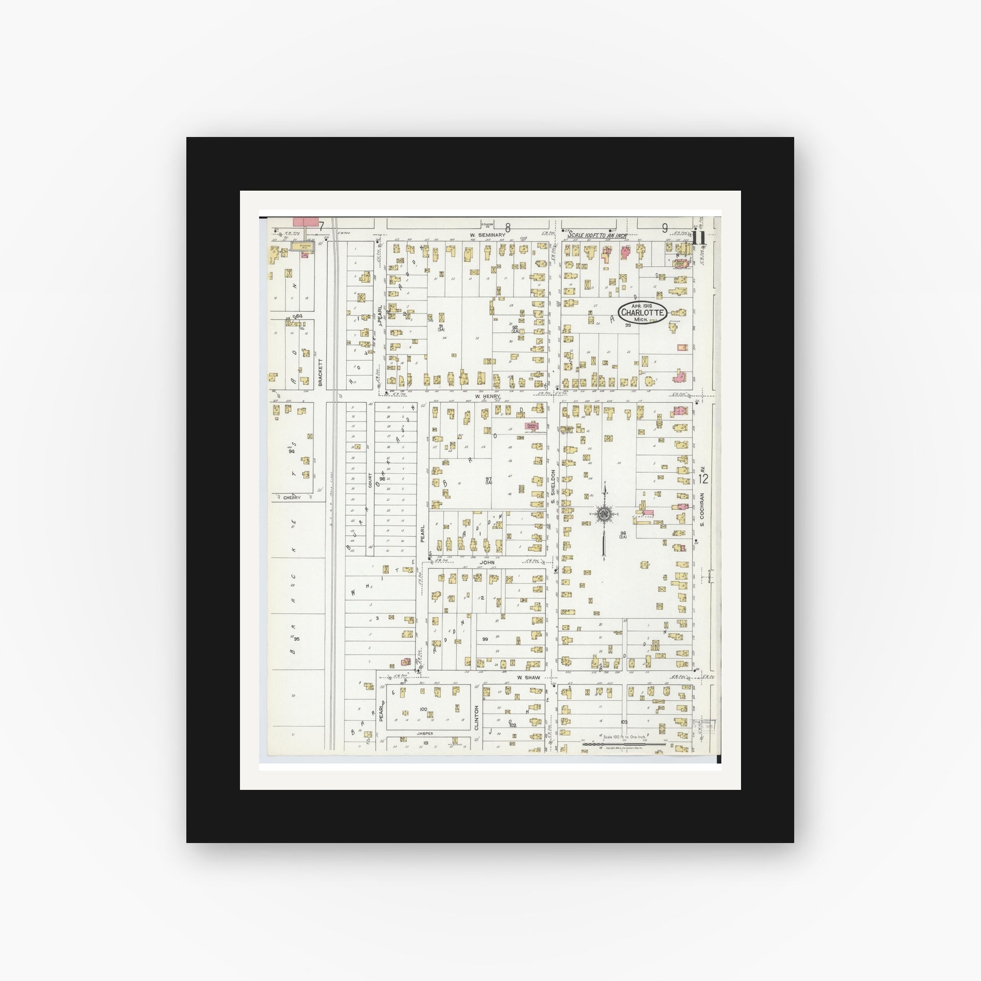 Old map wall art mockup — black gallery frame with white mat — Sanborn Fire Insurance Map from Charlotte, Eaton County, Michigan (1918), Sheet #0011