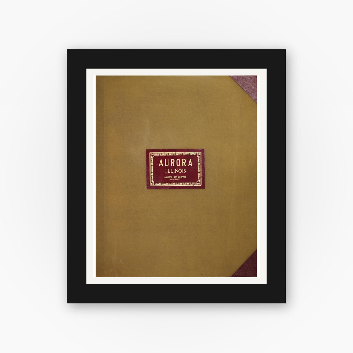 Old map wall art mockup — black gallery frame with white mat — Sanborn Fire Insurance Map from Aurora, Kane County, Illinois (1950), Sheet #0001