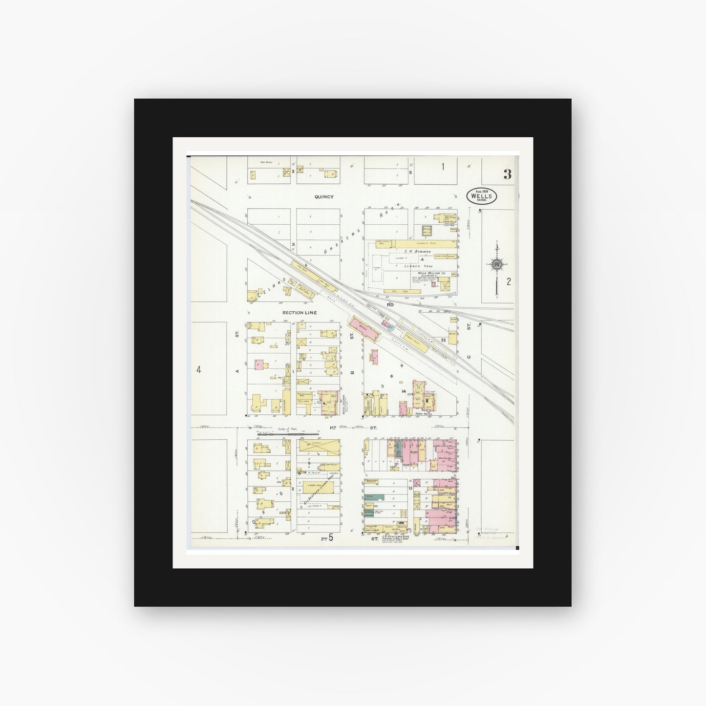 Old map wall art mockup — black gallery frame with white mat — Sanborn Fire Insurance Map from Wells, Faribault County, Minnesota (1909), Sheet #0003