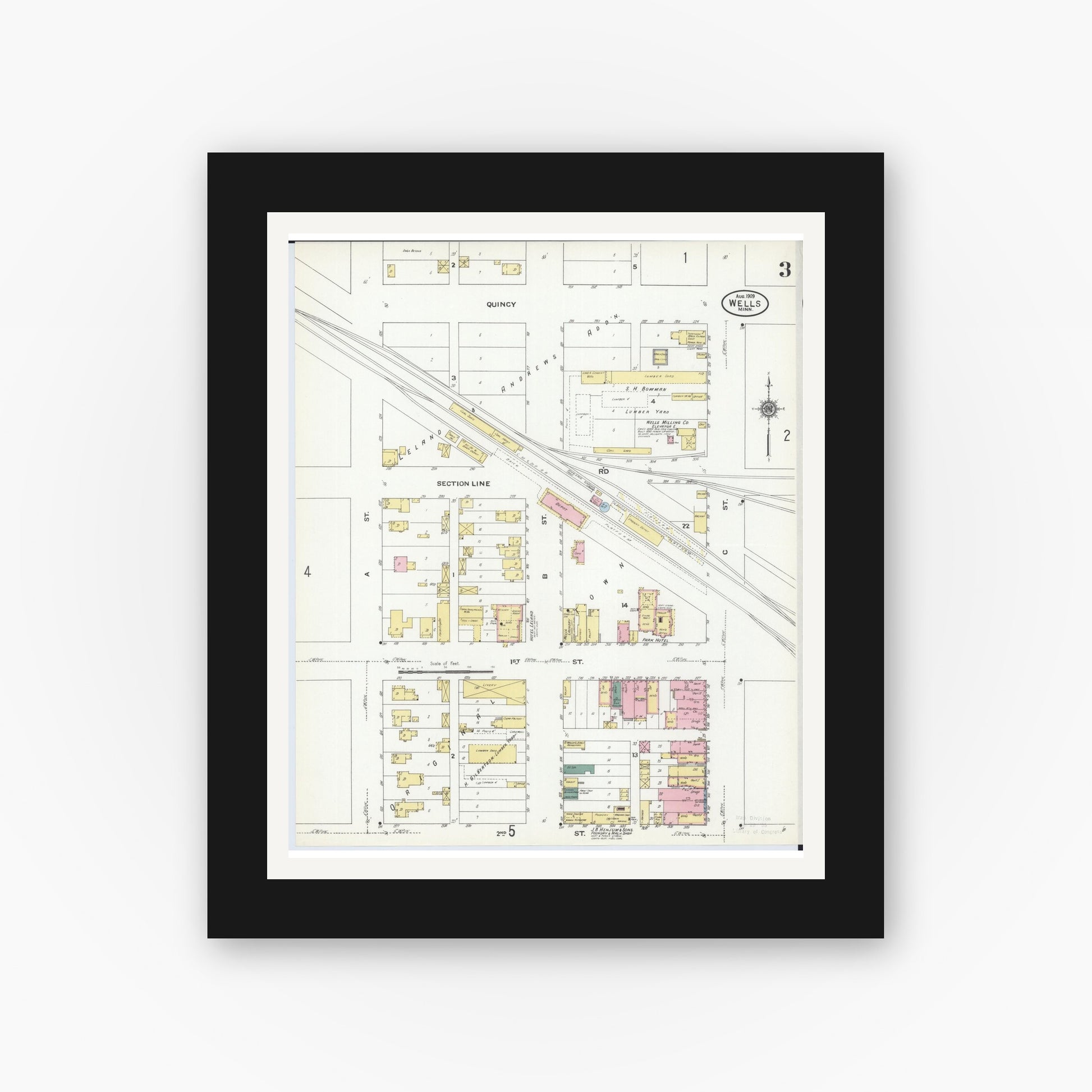 Old map wall art mockup — black gallery frame with white mat — Sanborn Fire Insurance Map from Wells, Faribault County, Minnesota (1909), Sheet #0003