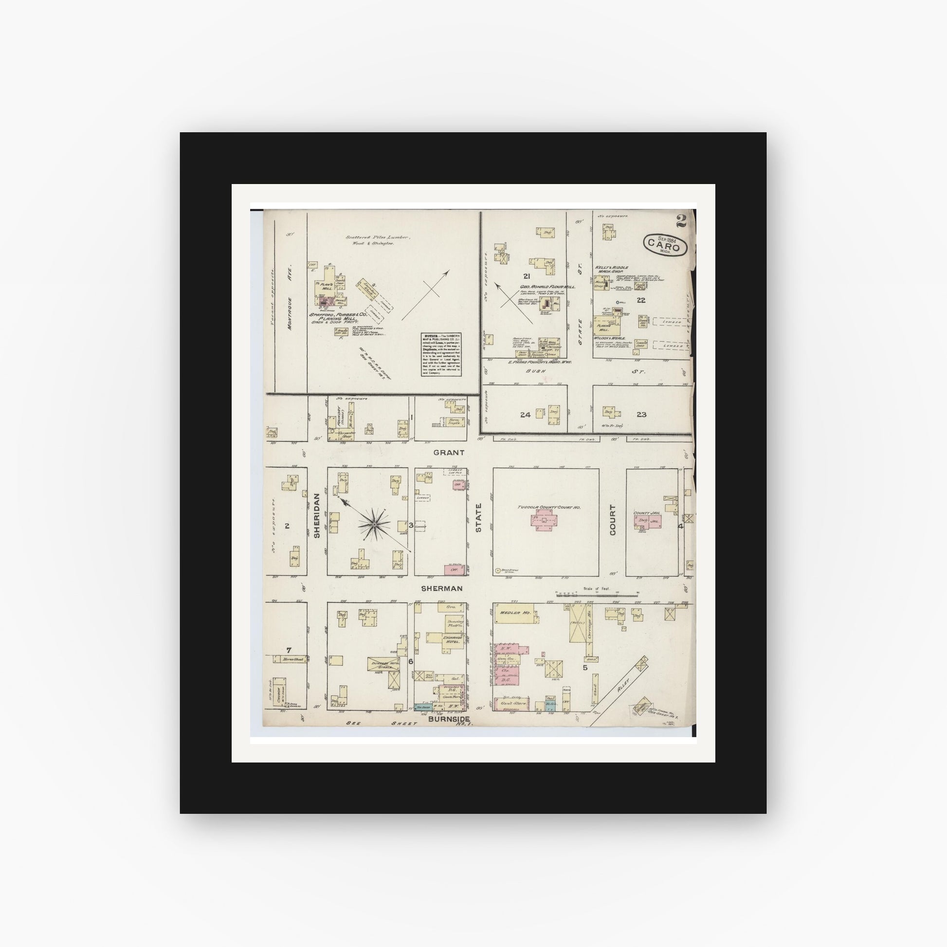 Old map wall art mockup — black gallery frame with white mat — Sanborn Fire Insurance Map from Caro, Tuscola County, Michigan (1884), Sheet #0002