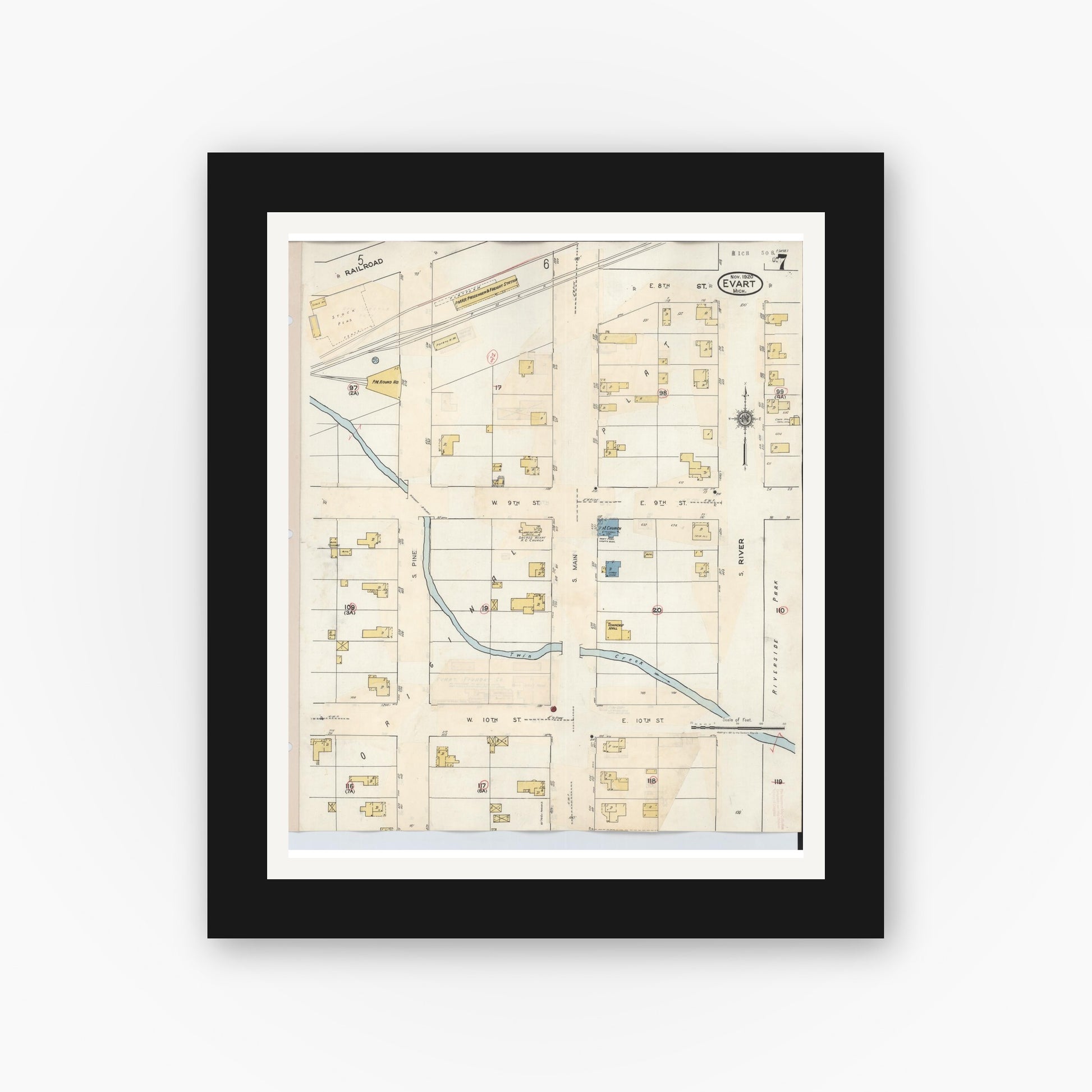 Old map wall art mockup — black gallery frame with white mat — Sanborn Fire Insurance Map from Evart, Osceola County, Michigan (1942), Sheet #0007