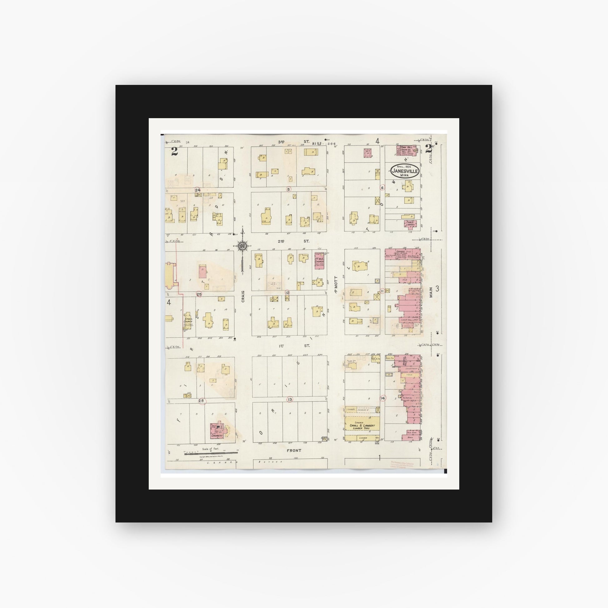 Old map wall art mockup — black gallery frame with white mat — Sanborn Fire Insurance Map from Janesville, Waseca County, Minnesota (1937), Sheet #0002