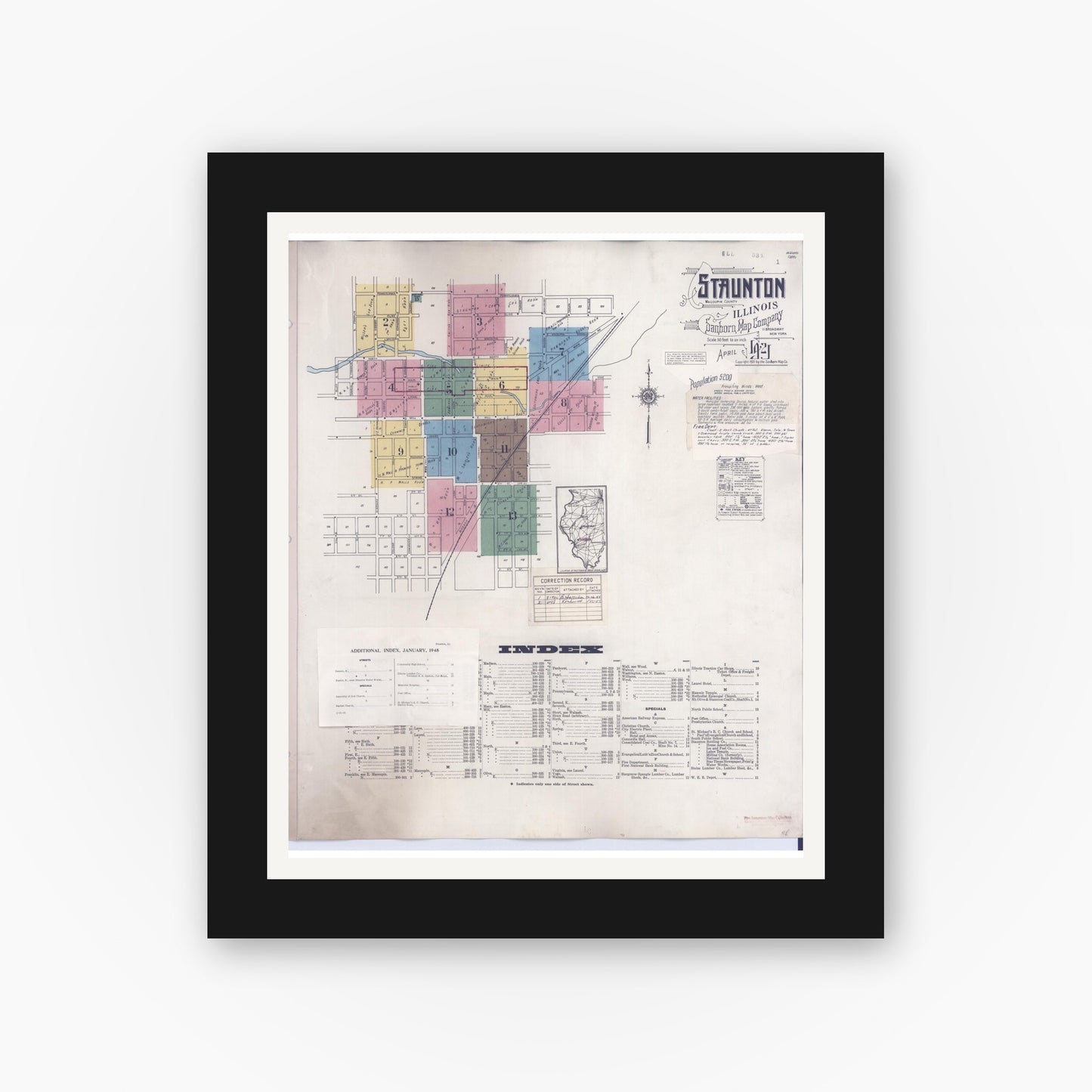 Old map wall art mockup — black gallery frame with white mat — Sanborn Fire Insurance Map from Staunton, Macoupin County, Illinois (1948), Sheet #0001