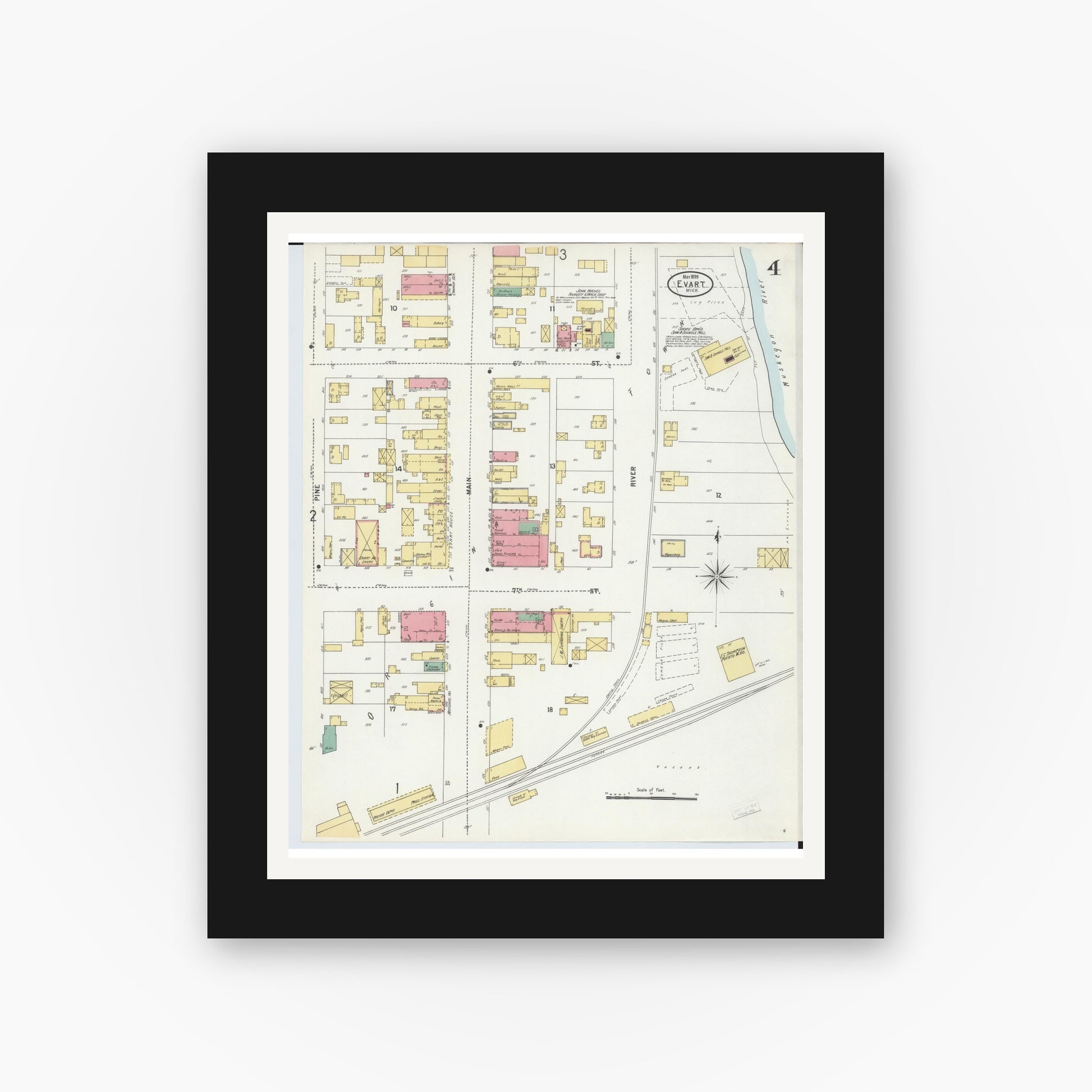 Old map wall art mockup — black gallery frame with white mat — Sanborn Fire Insurance Map from Evart, Osceola County, Michigan (1899), Sheet #0004
