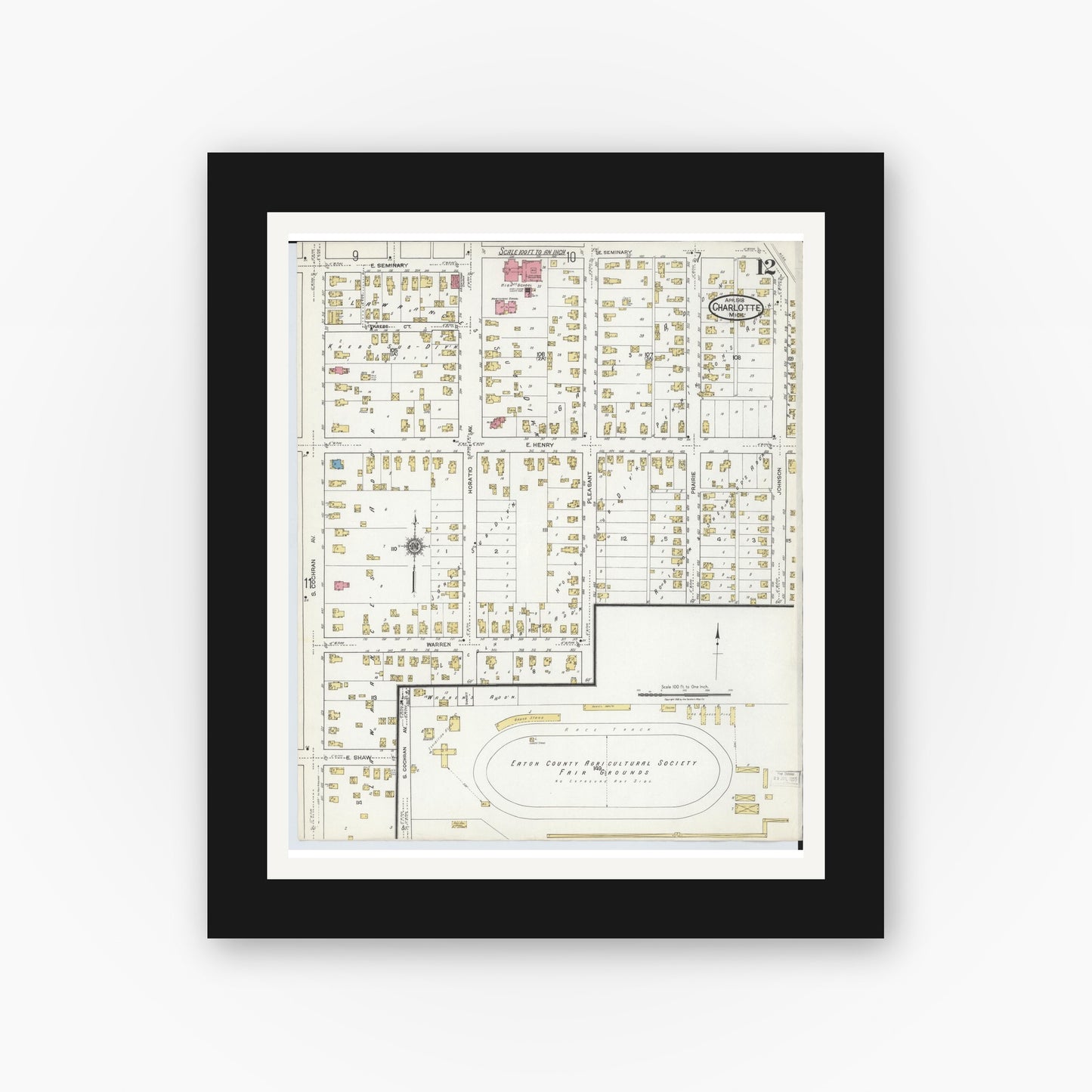 Old map wall art mockup — black gallery frame with white mat — Sanborn Fire Insurance Map from Charlotte, Eaton County, Michigan (1918), Sheet #0012