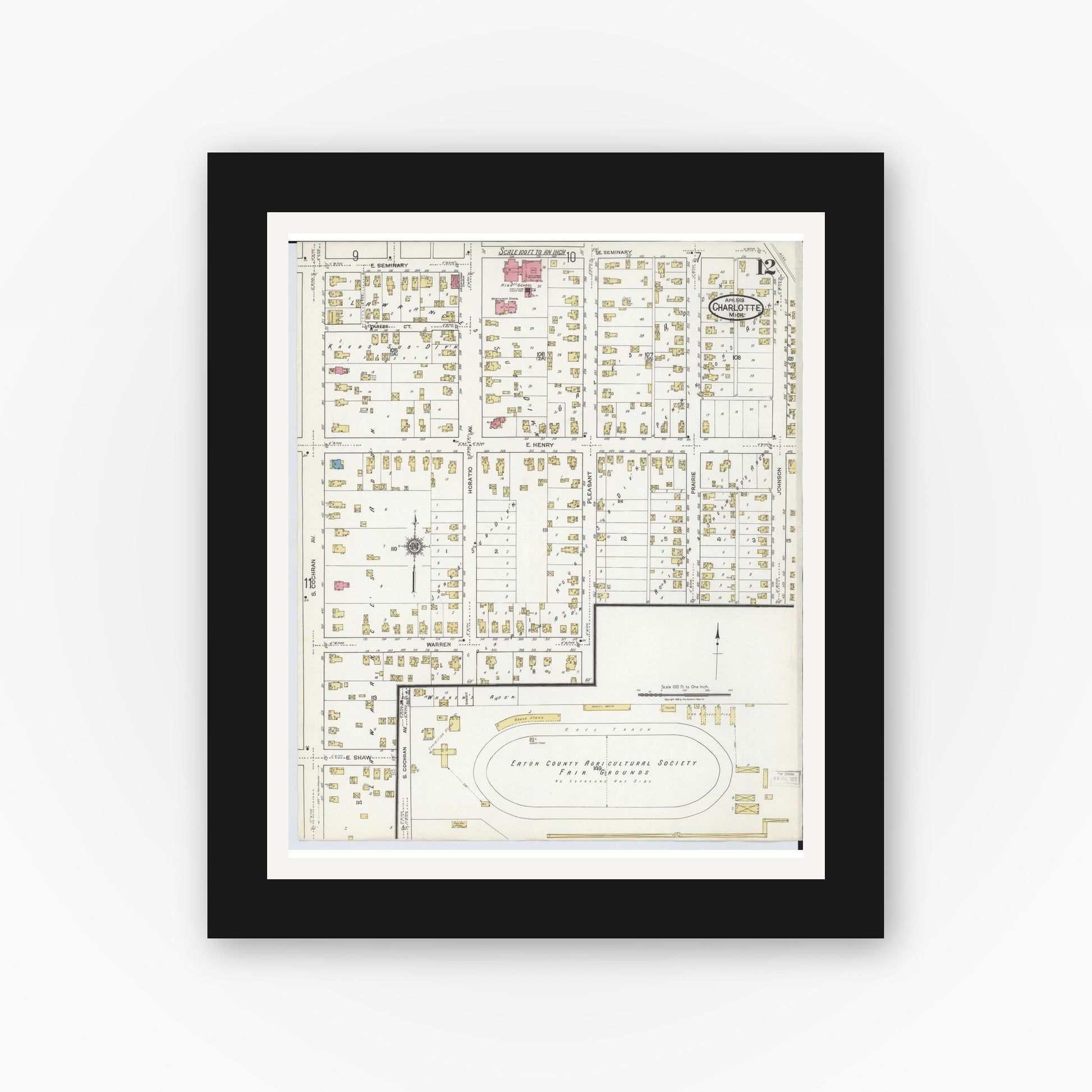 Old map wall art mockup — black gallery frame with white mat — Sanborn Fire Insurance Map from Charlotte, Eaton County, Michigan (1918), Sheet #0012