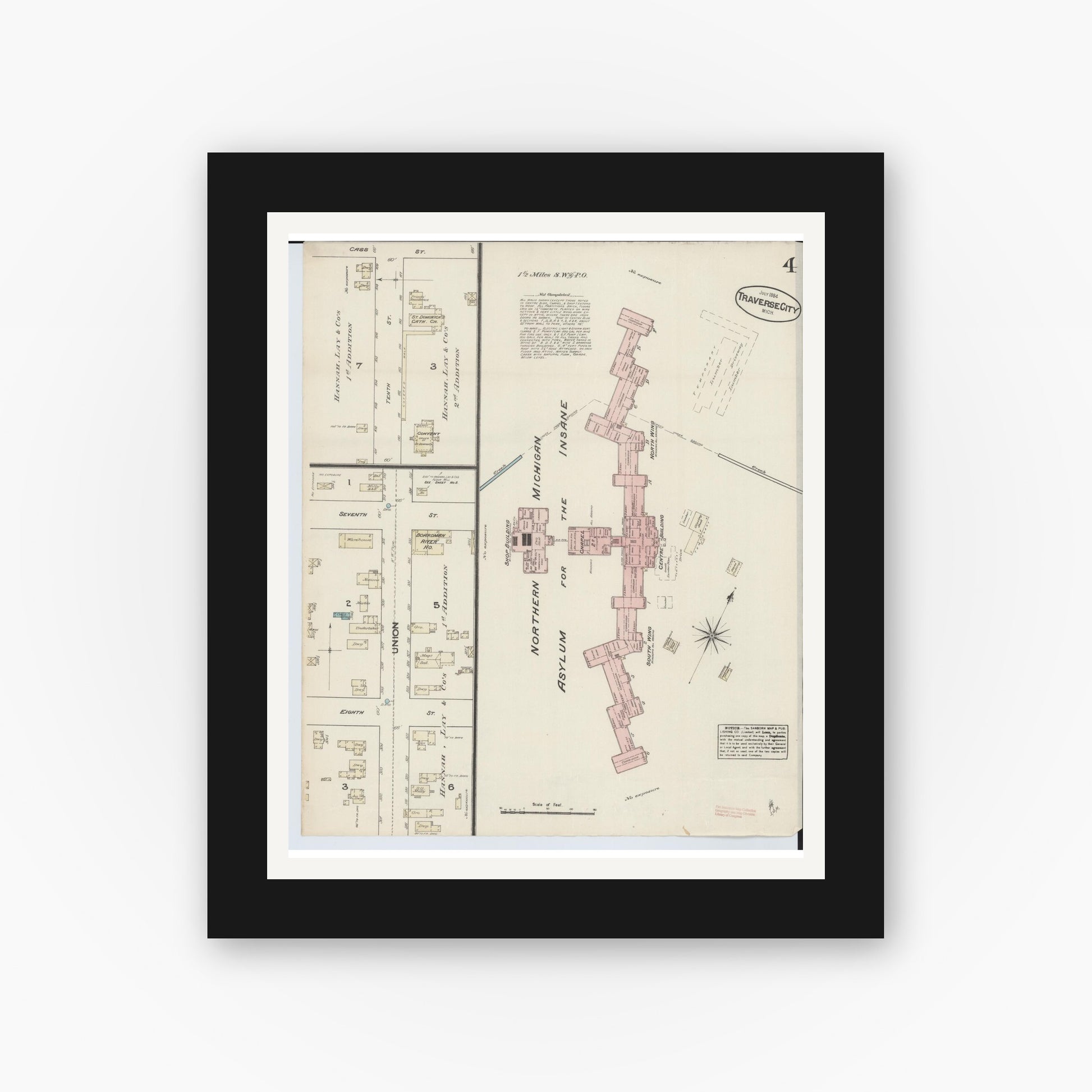 Old map wall art mockup — black gallery frame with white mat — Sanborn Fire Insurance Map from Traverse City, Grand Traverse County, Michigan (1884), Sheet #0004