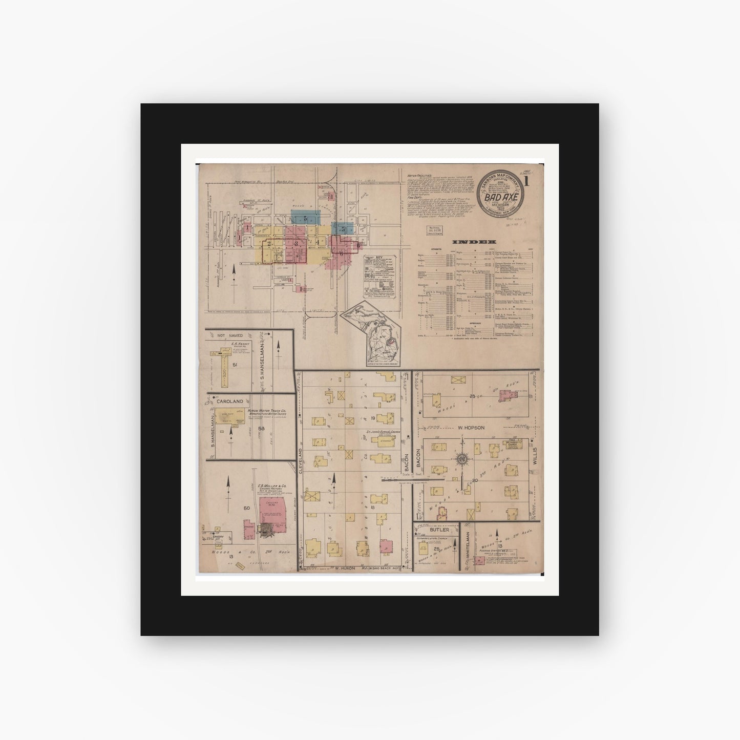 Old map wall art mockup — black gallery frame with white mat — Sanborn Fire Insurance Map from Bad Axe, Huron County, Michigan (1922), Sheet #0001