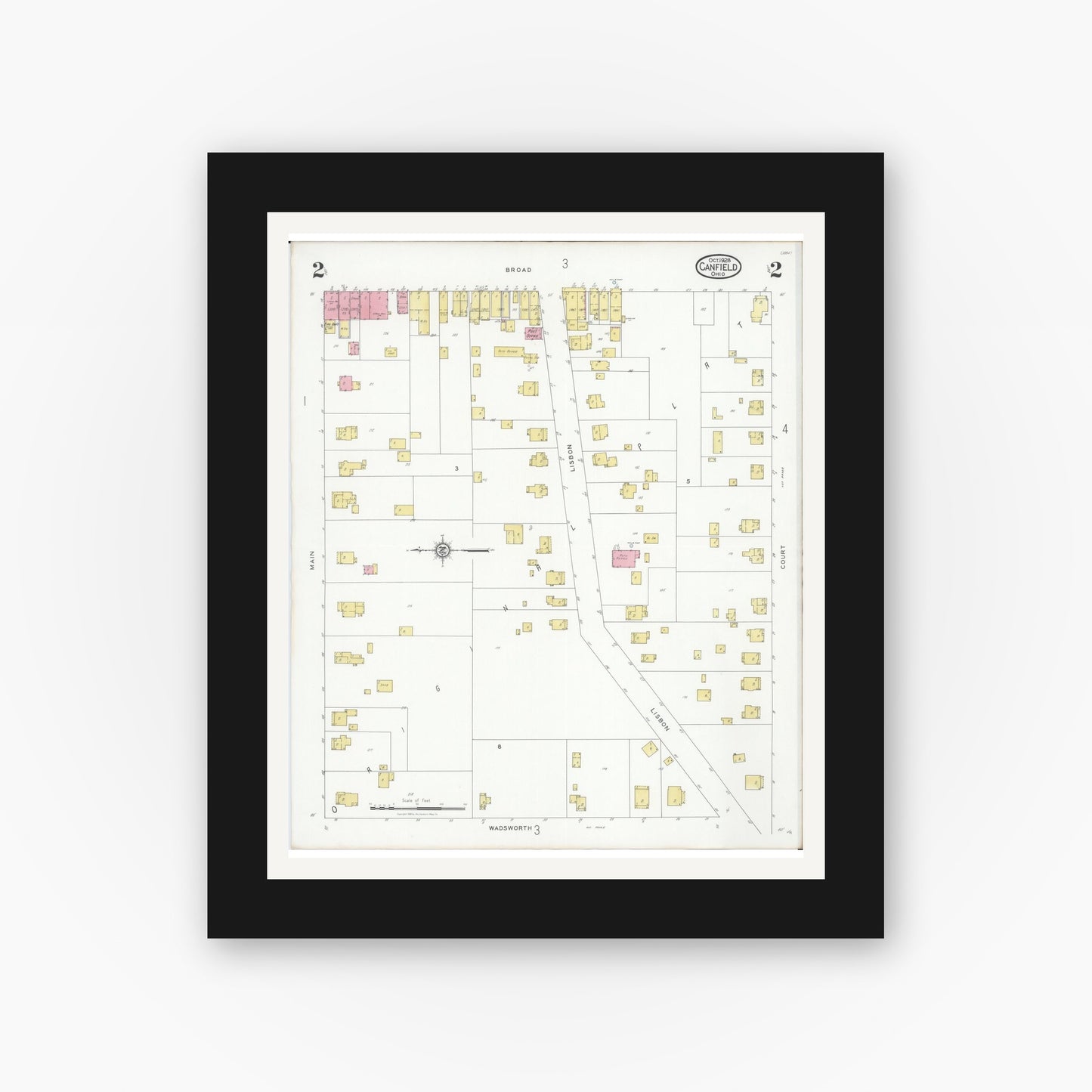 Old map wall art mockup — black gallery frame with white mat — Sanborn Fire Insurance Map from Canfield, Mahoning County, Ohio (1928), Sheet #0002