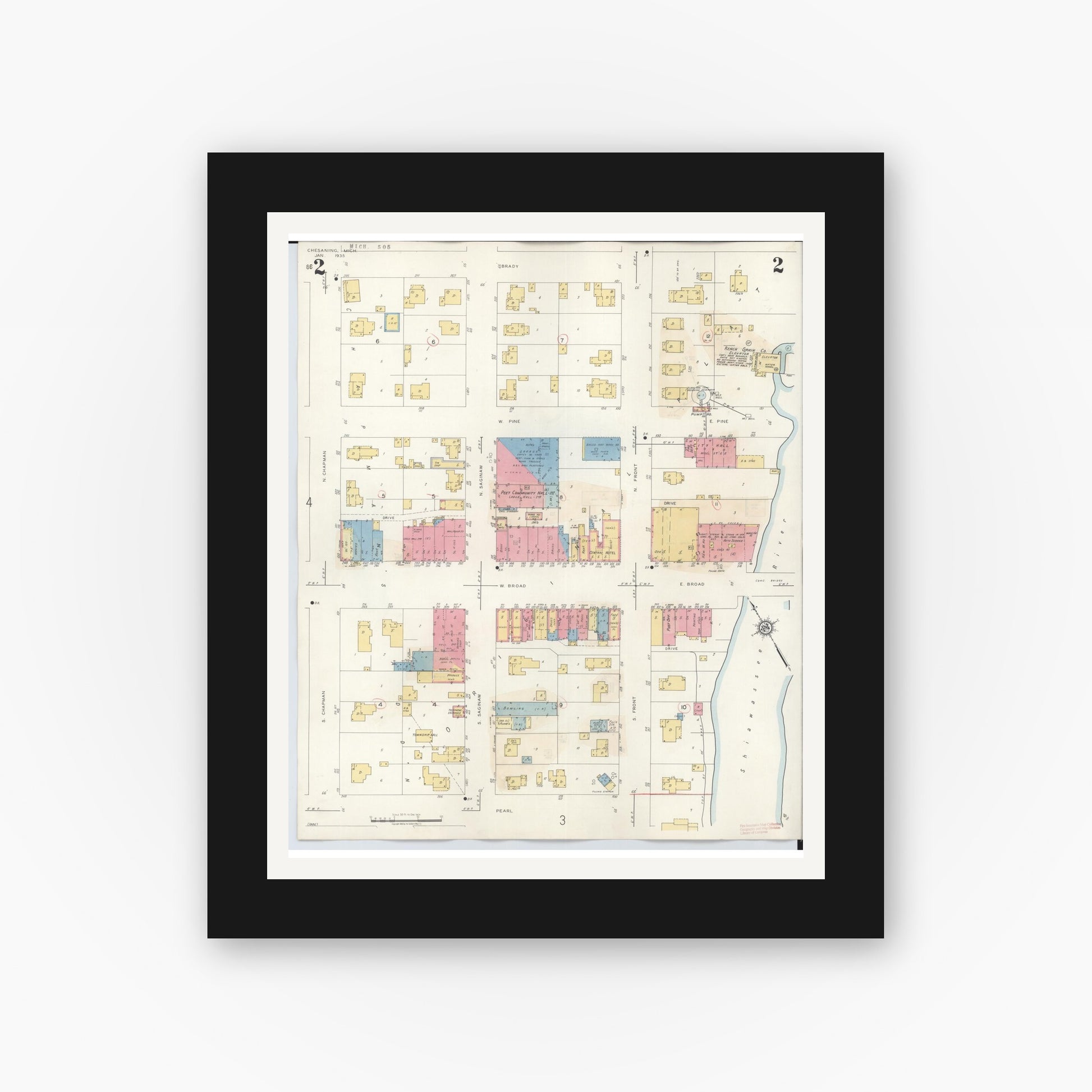 Old map wall art mockup — black gallery frame with white mat — Sanborn Fire Insurance Map from Chesaning, Saginaw County, Michigan (1944), Sheet #0002