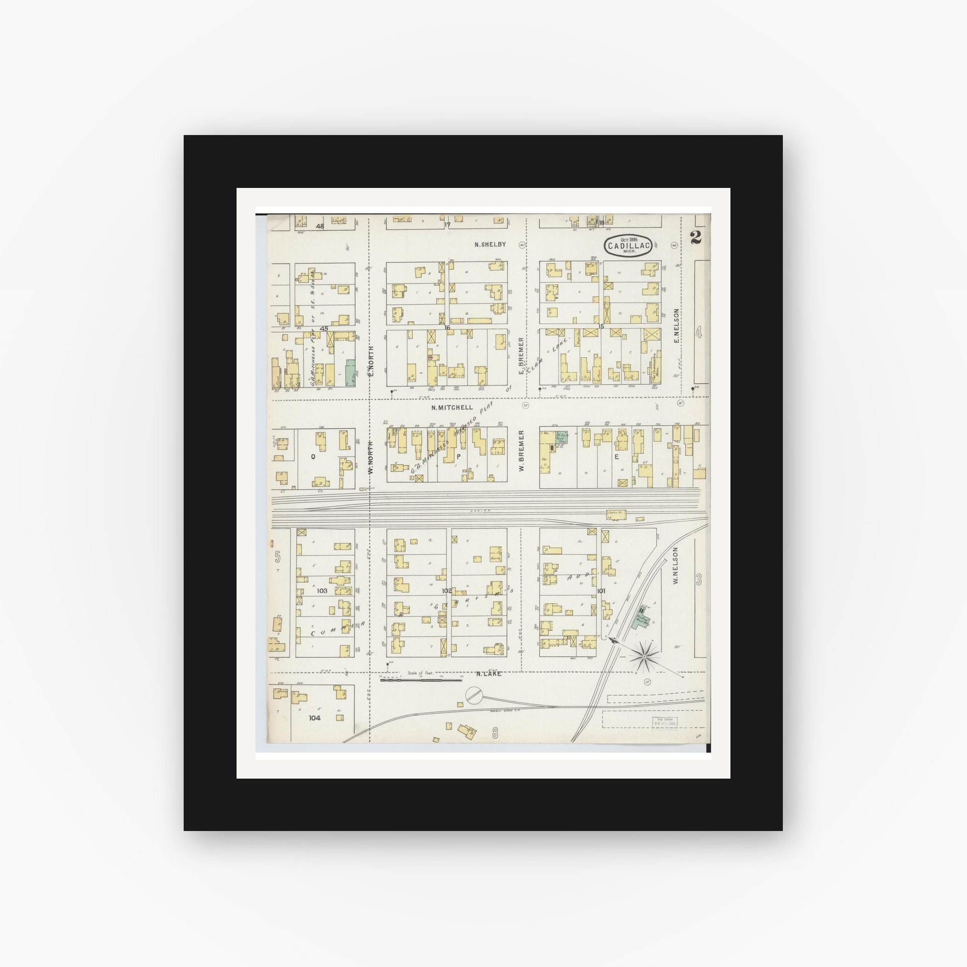 Old map wall art mockup — black gallery frame with white mat — Sanborn Fire Insurance Map from Cadillac, Wexford County, Michigan (1895), Sheet #0002