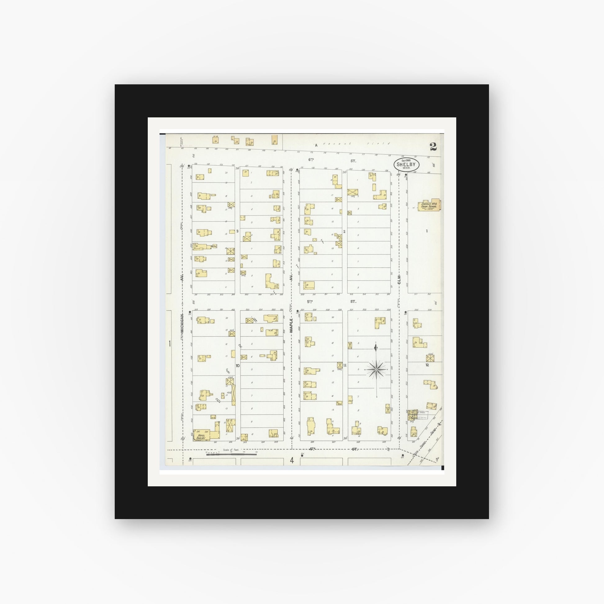 Old map wall art mockup — black gallery frame with white mat — Sanborn Fire Insurance Map from Shelby, Oceana County, Michigan (1900), Sheet #0002
