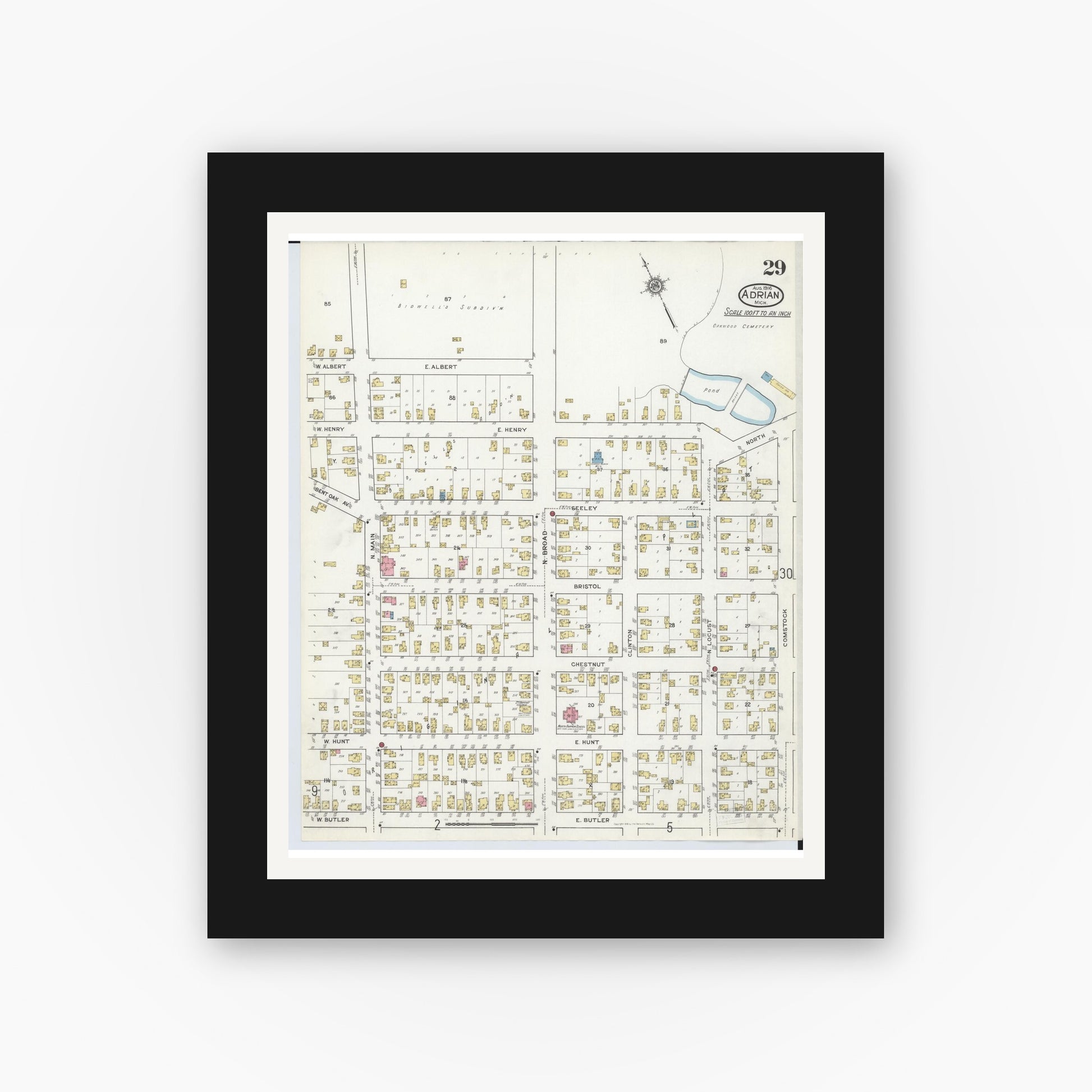 Old map wall art mockup — black gallery frame with white mat — Sanborn Fire Insurance Map from Adrian, Lenawee County, Michigan (1916), Sheet #0029