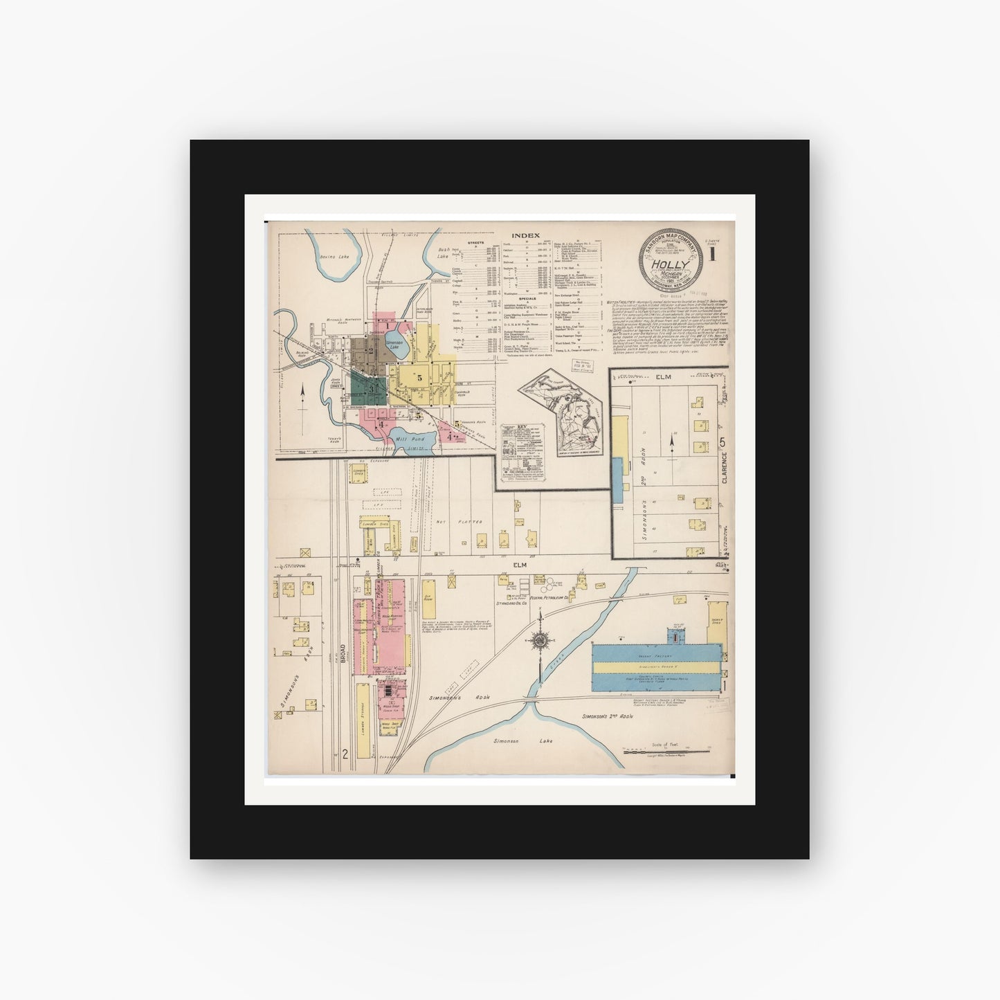 Old map wall art mockup — black gallery frame with white mat — Sanborn Fire Insurance Map from Holly, Oakland County, Michigan (1921), Sheet #0001