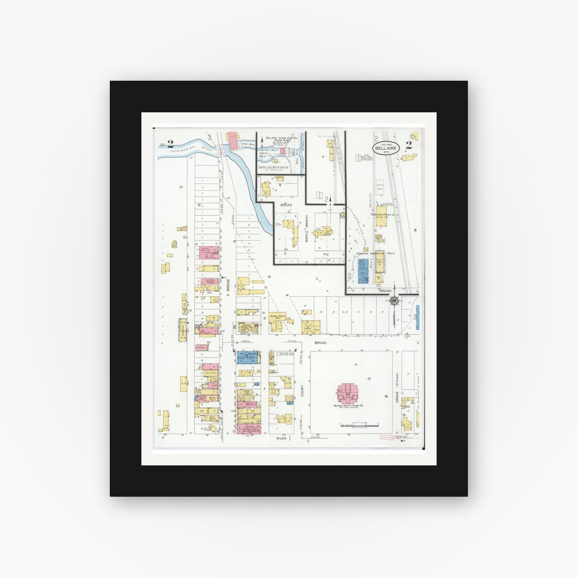 Old map wall art mockup — black gallery frame with white mat — Sanborn Fire Insurance Map from Bellaire, Antrim County, Michigan (1929), Sheet #0002