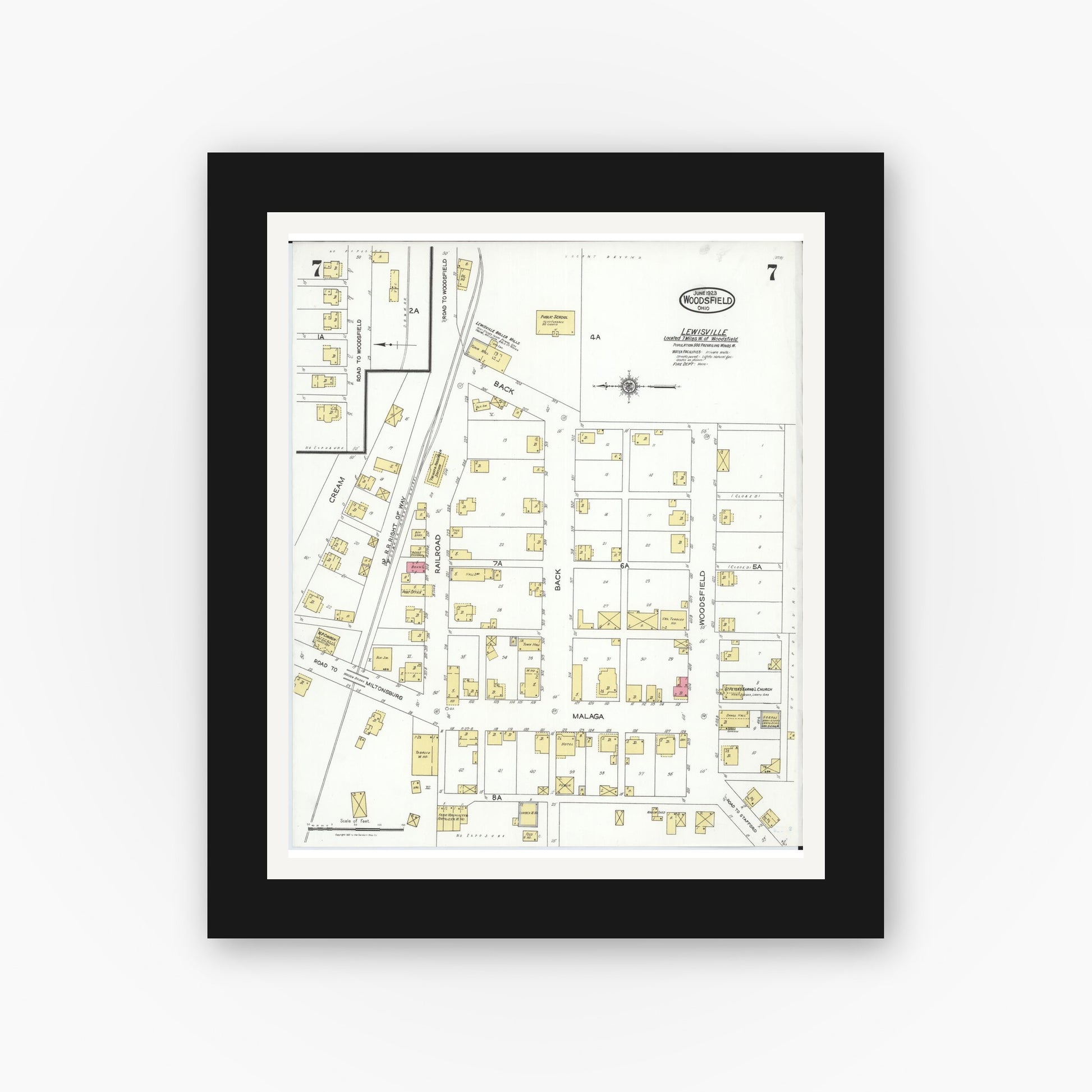 Old map wall art mockup — black gallery frame with white mat — Sanborn Fire Insurance Map from Woodsfield, Monroe County, Ohio (1923), Sheet #0007